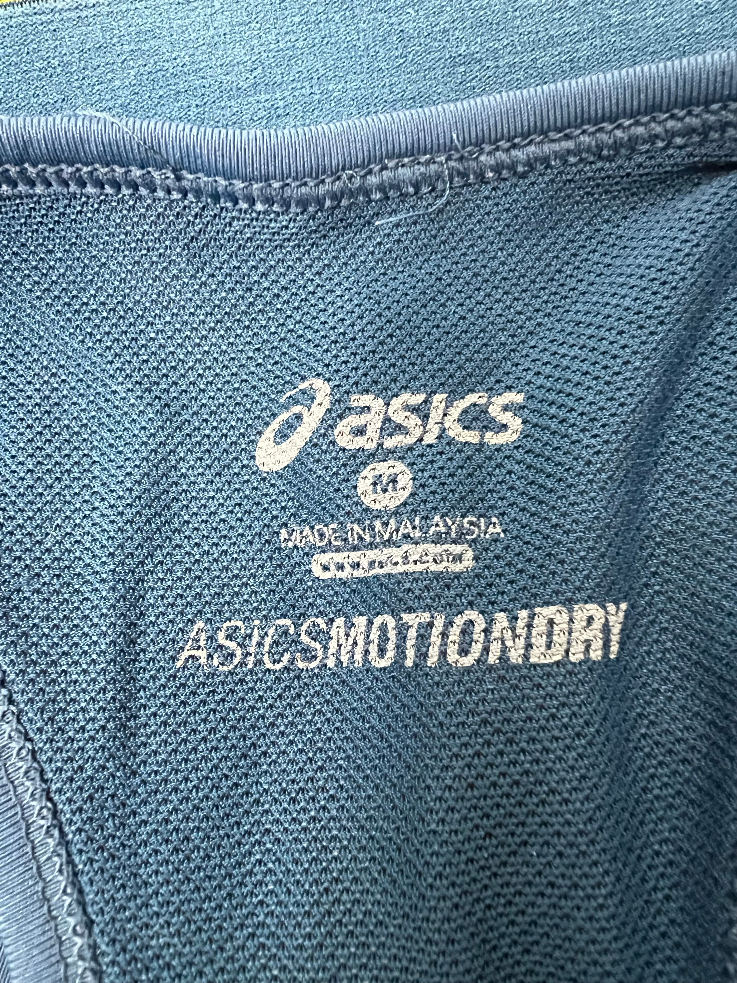 Close-up of interior Asics MotionDry label and mesh fabric of sports bra