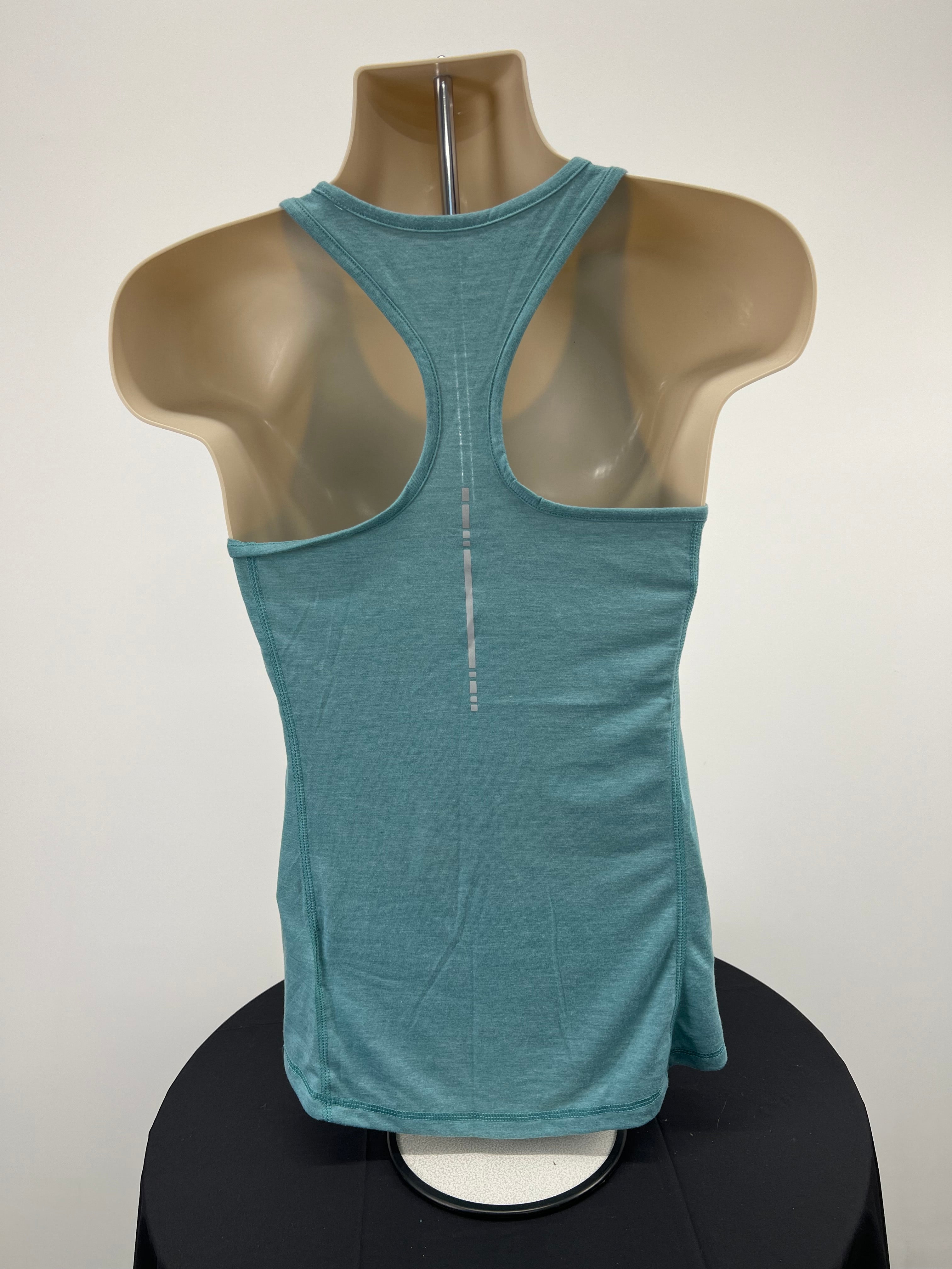 Back view of Asics light green racerback vest top on mannequin