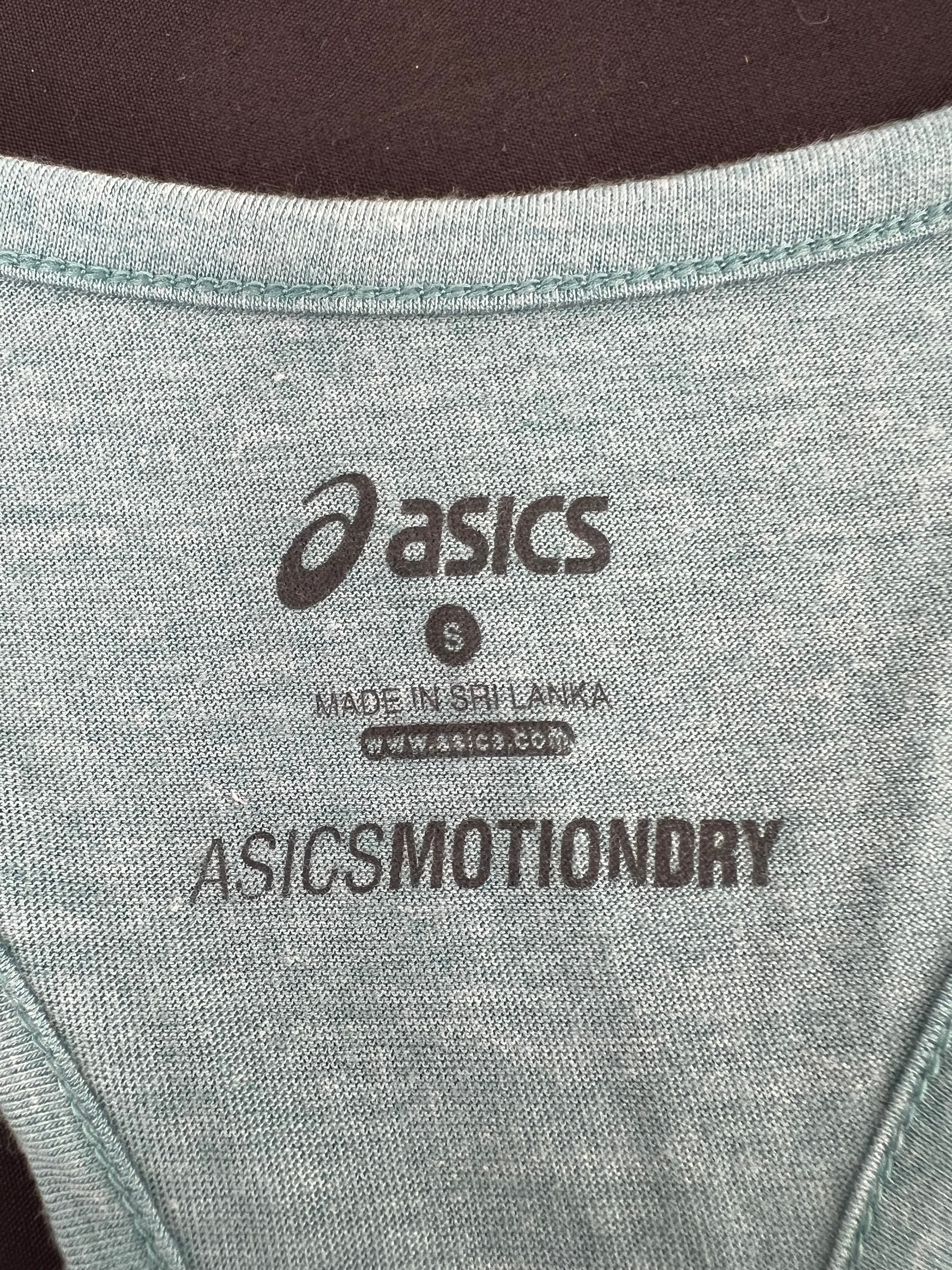 Close-up of Asics MotionDry label and size S marking inside the vest top
