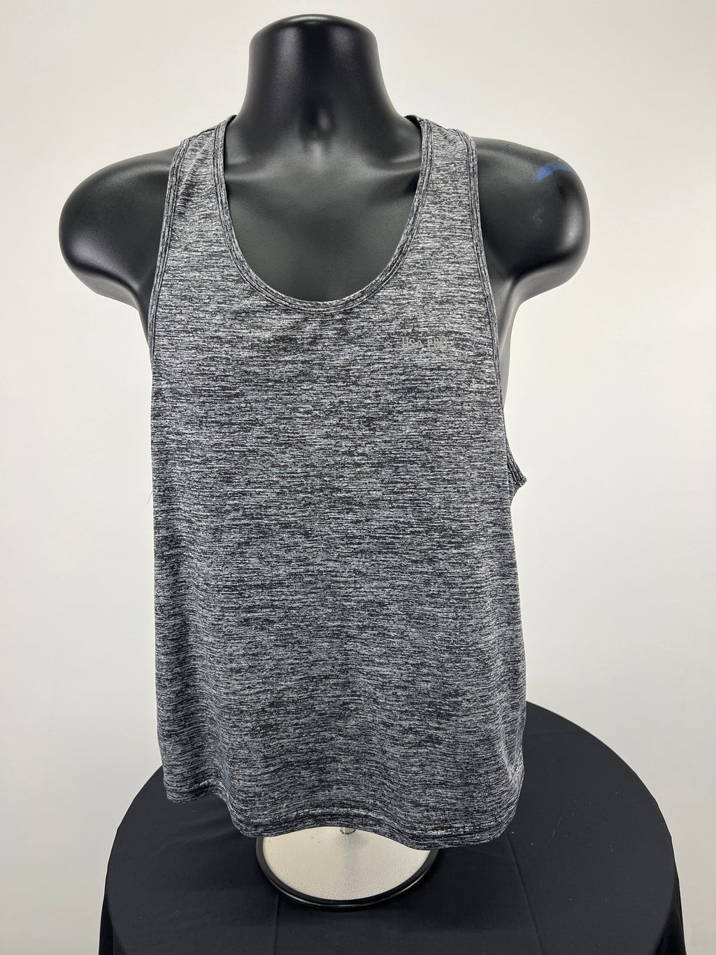 Front view of USA Pro sports vest in grey marl on black mannequin