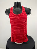 Front view of Adidas red sports vest with streak pattern on black mannequin