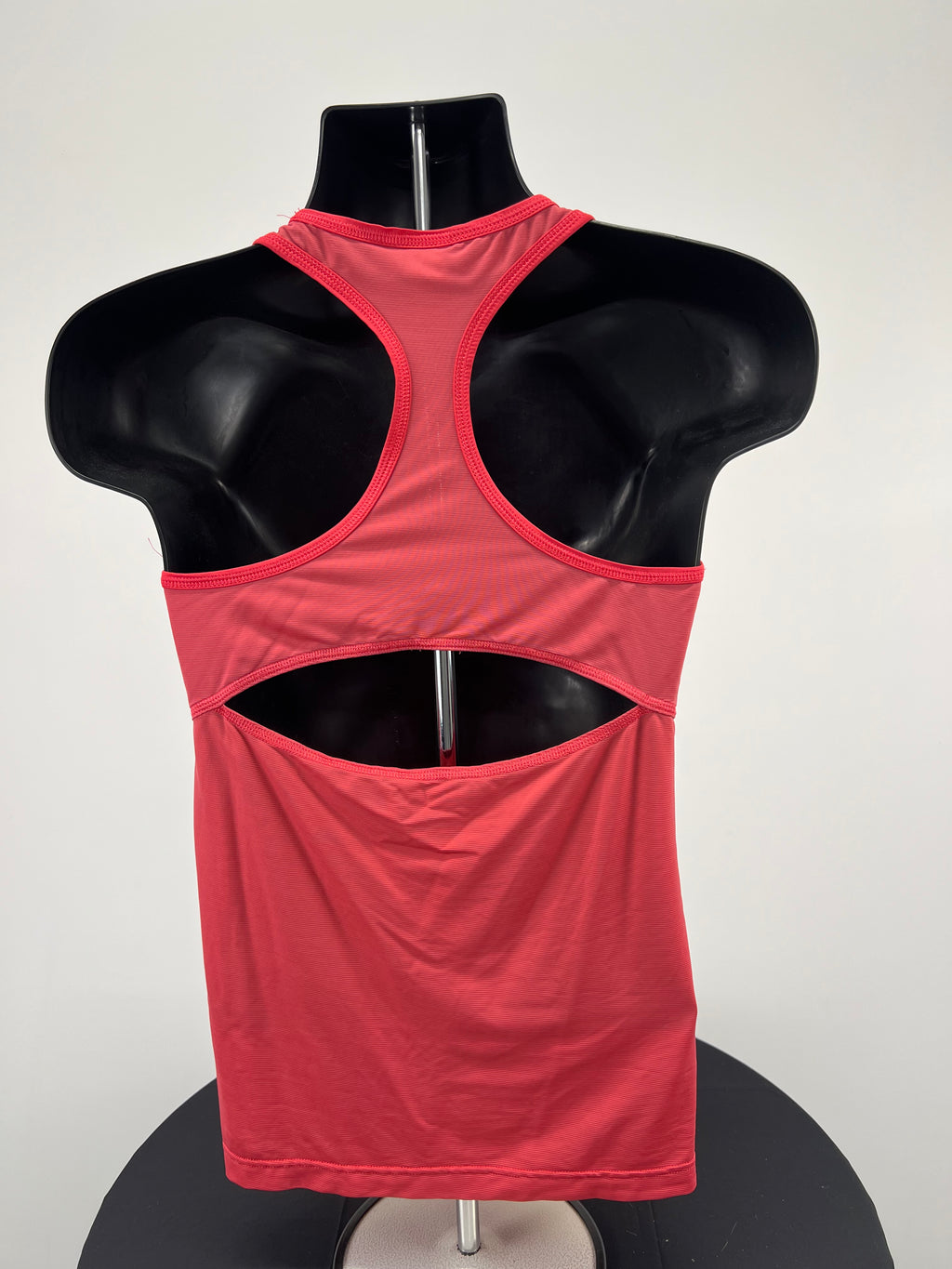 Back view of Adidas red racerback sports vest showing cut-out detail