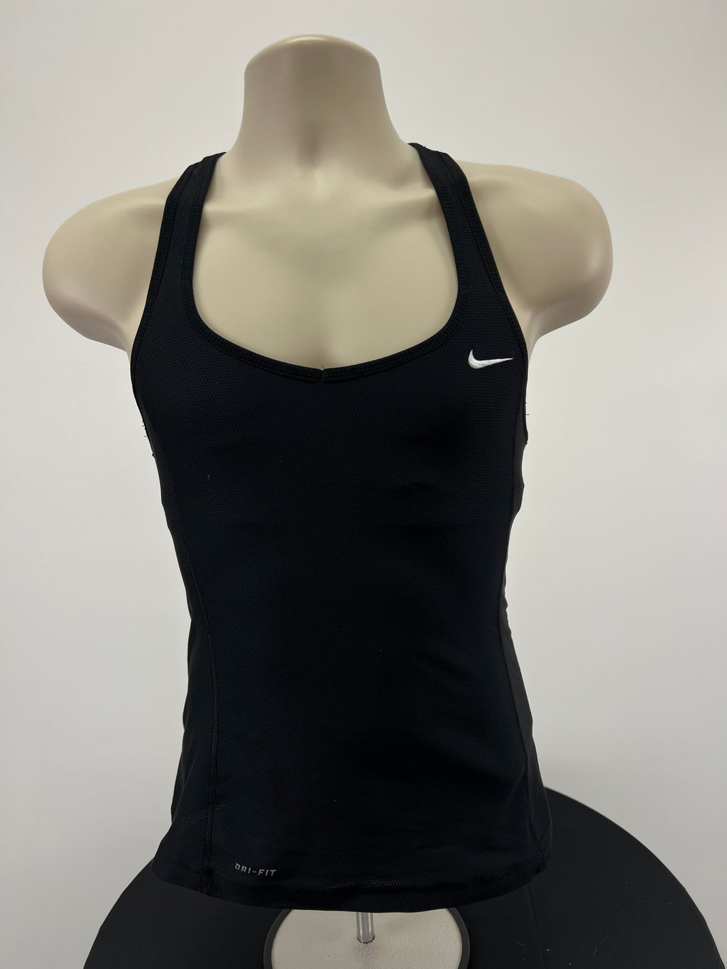 Front view of black Nike Dri-FIT sports vest with built-in bra on mannequin