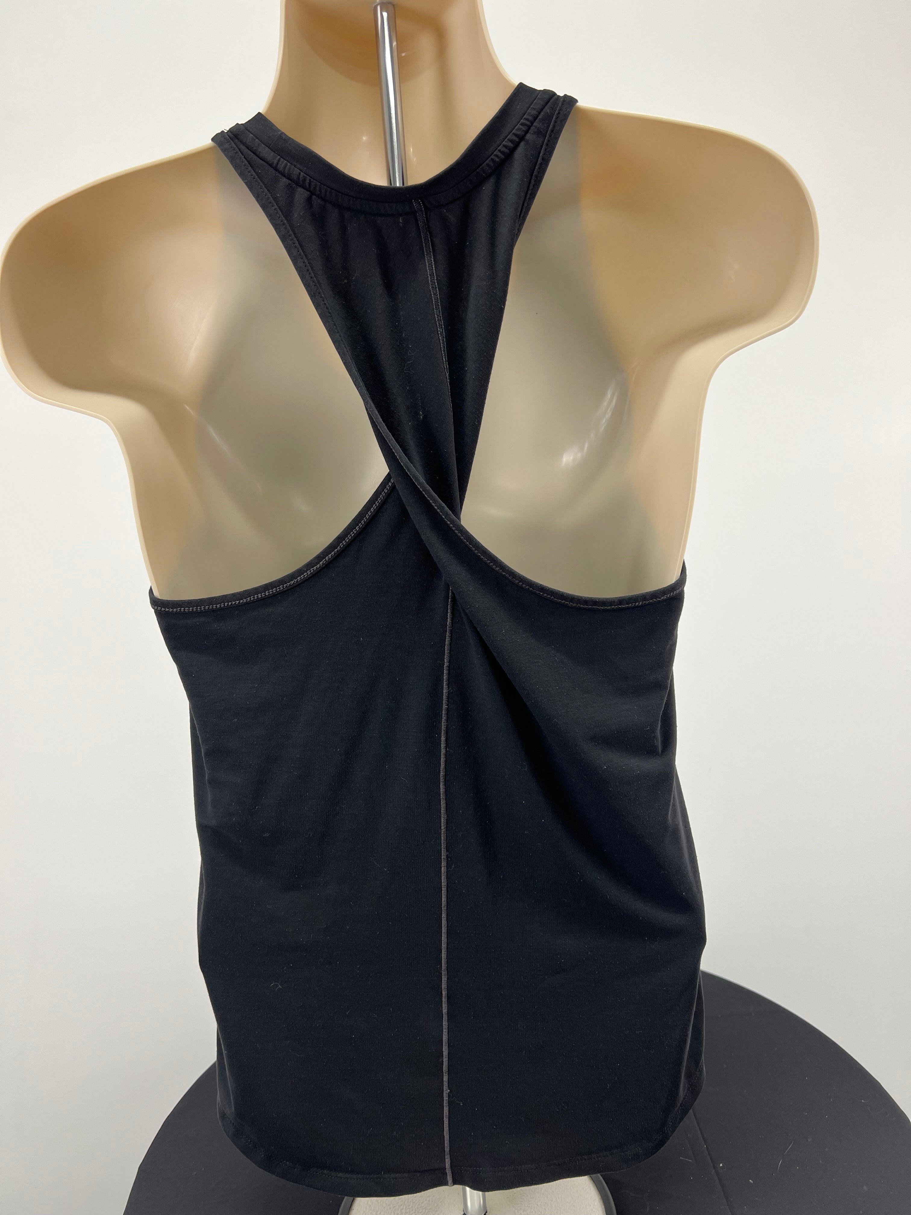Back view of black Nike training vest showing unique crossover strap design