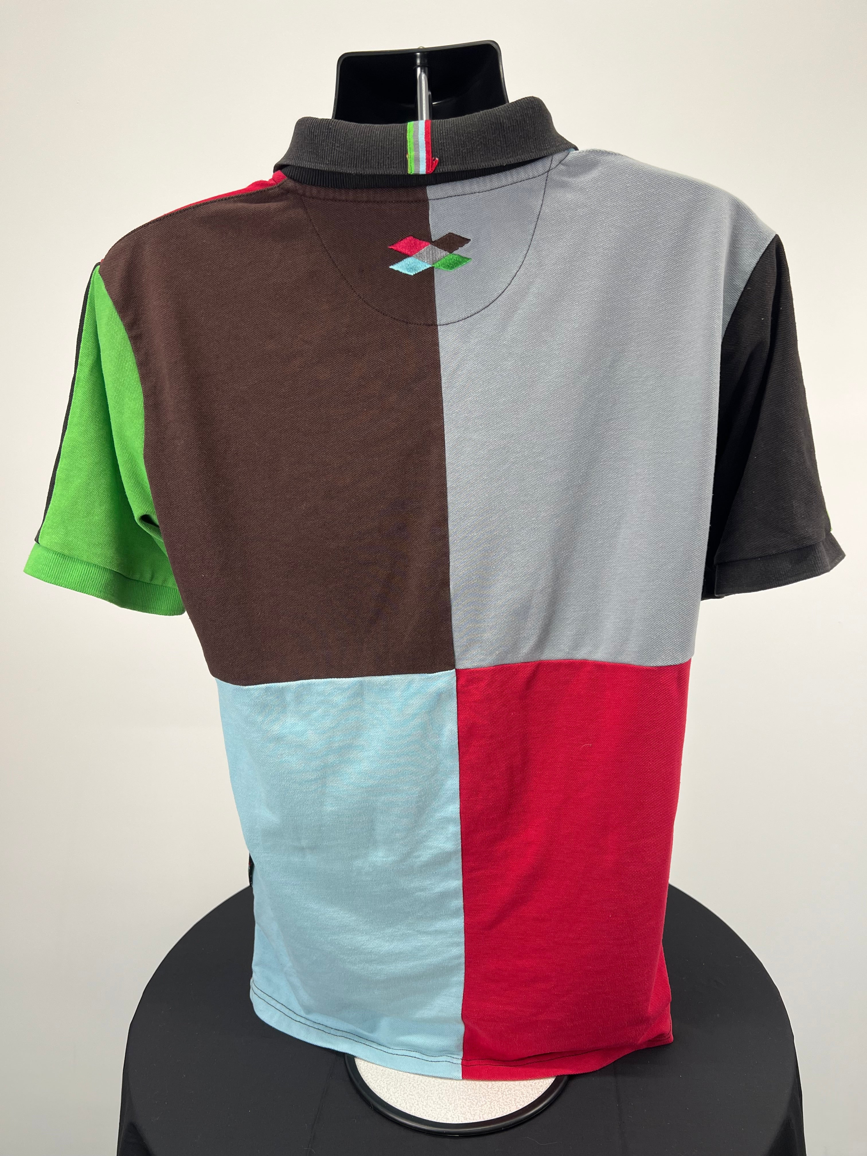 Back view of Harlequins rugby club polo shirt showing distinctive colour-block panels with black collar and rugby style detailing