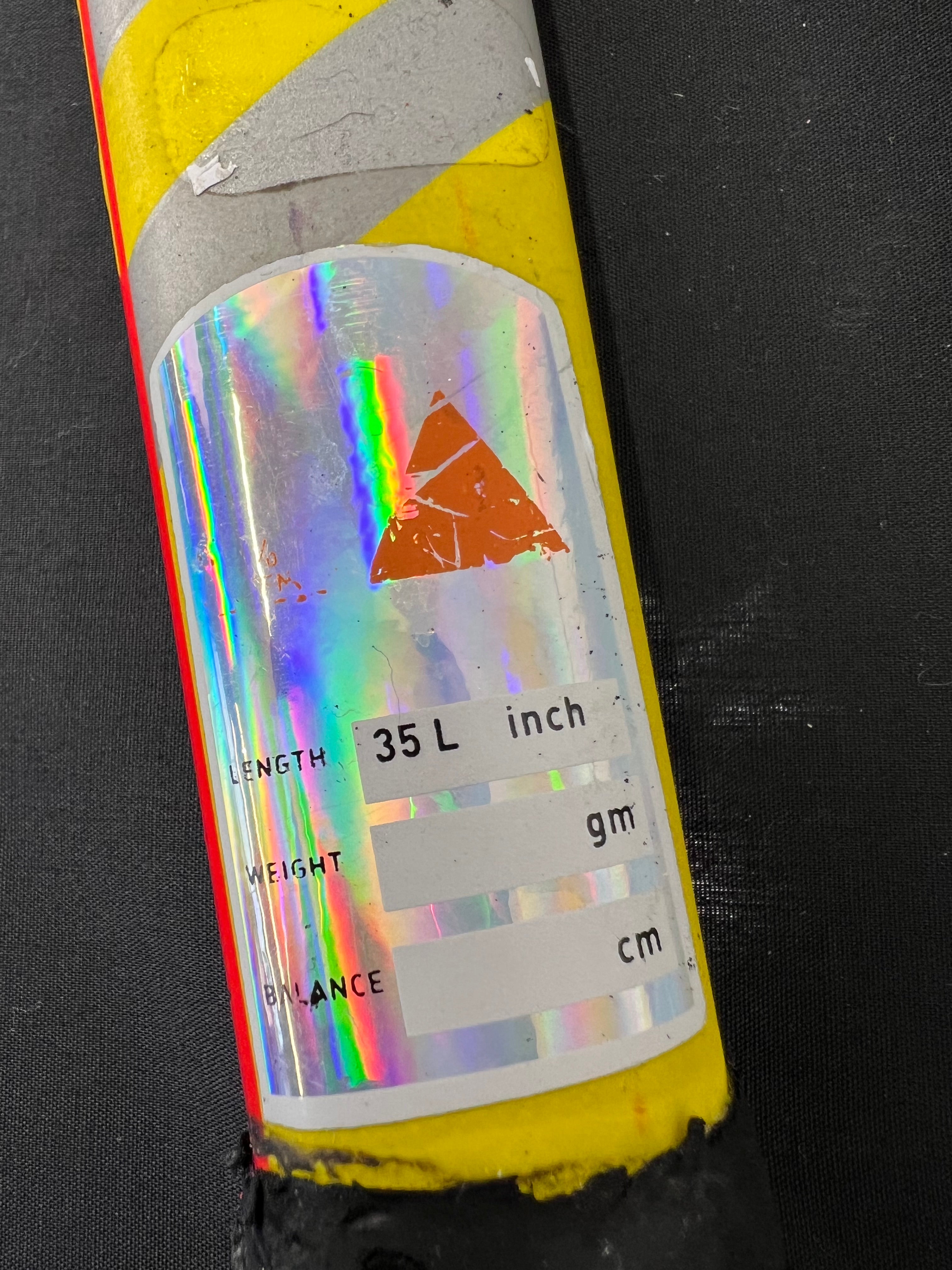 Holographic sticker label on the shaft indicating length 35 inches with additional blank fields for weight and balance