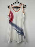 Front view of white Nike tennis dress with red and blue swirl pattern and peach-coloured trims on a black hanger