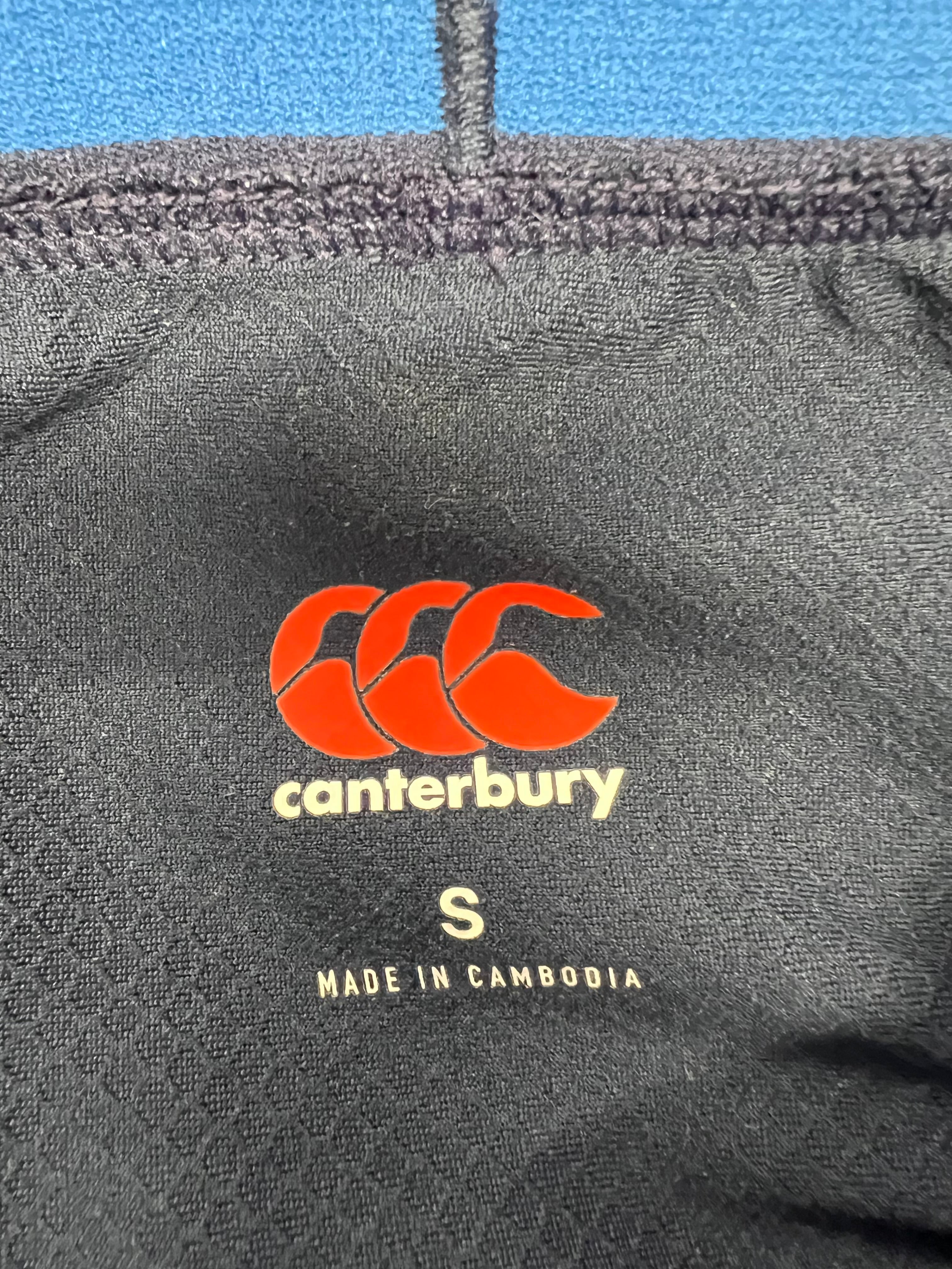 Close-up of Canterbury brand label inside leggings showing size Small and made in Cambodia