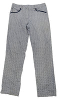 Women’s Golfino patterned golf trousers with navy and white zigzag design, laid flat on grass