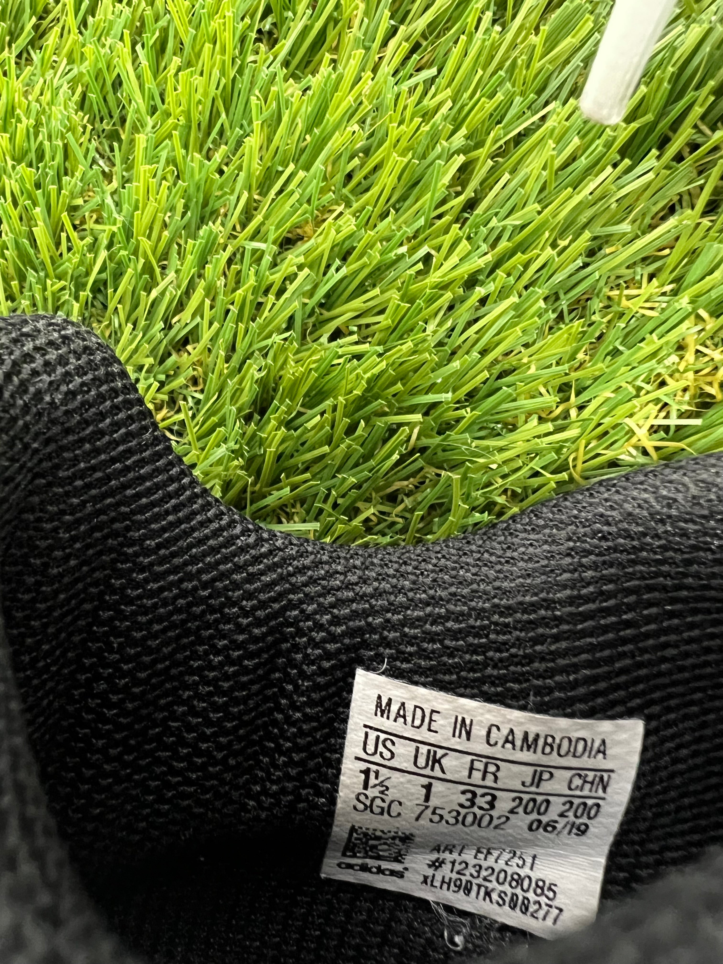 Close up of inside label of adidas kids football boot showing size 1 UK and manufacturing details