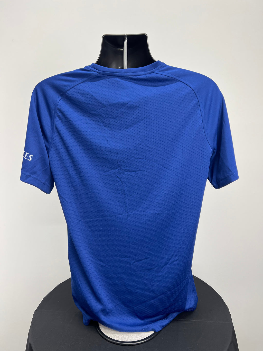 Back view of Canterbury men’s royal blue Team Dry Tee showing plain breathable fabric