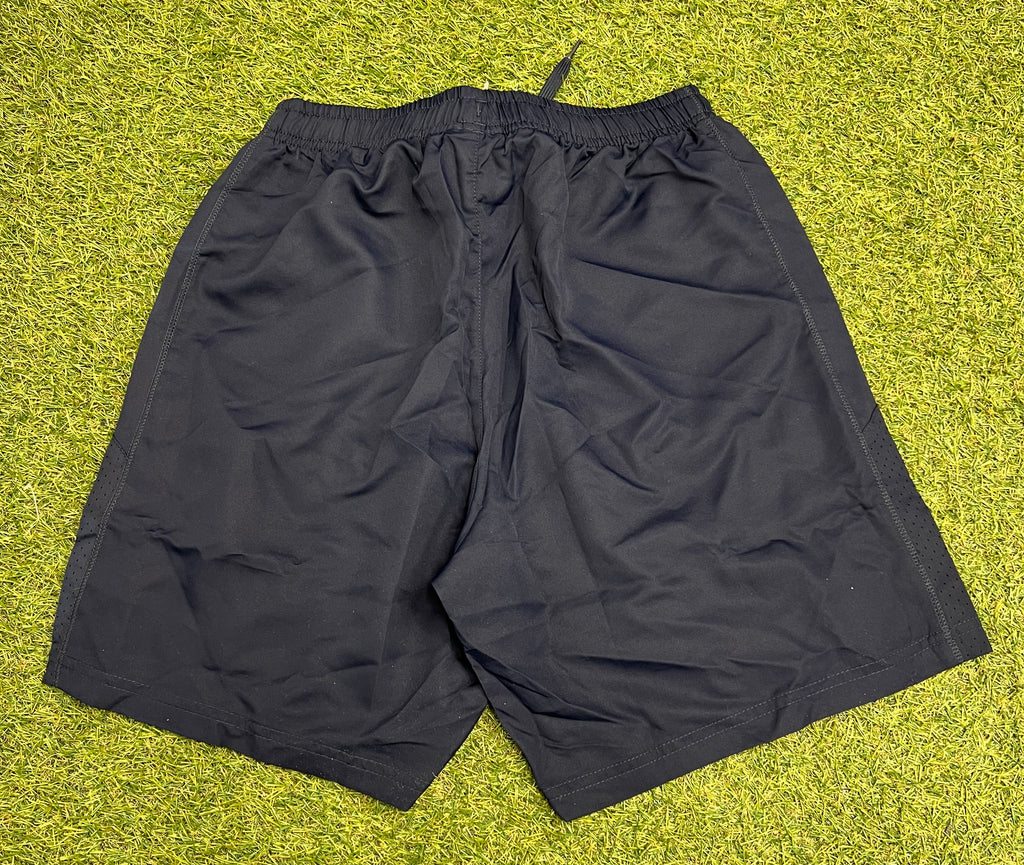 Back view of navy Canterbury team shorts showing solid design and mesh side panels