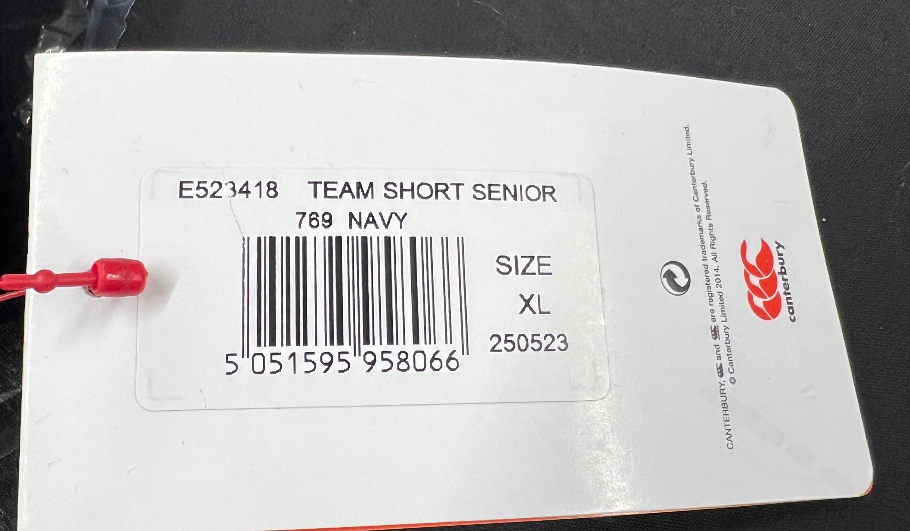 Canterbury team shorts product tag showing size XL and navy colour description
