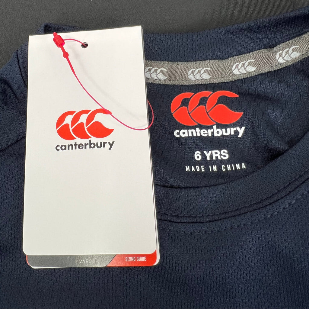 Close-up of label and tag showing Canterbury brand logo and size 6 years