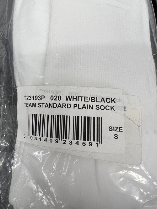 Close-up of packaging label on Canterbury white socks indicating team standard plain sock size S