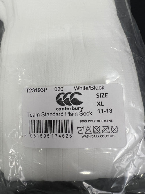 Close-up of Canterbury label on a pair of white men's team socks, size XL 11-13, 100% polypropylene