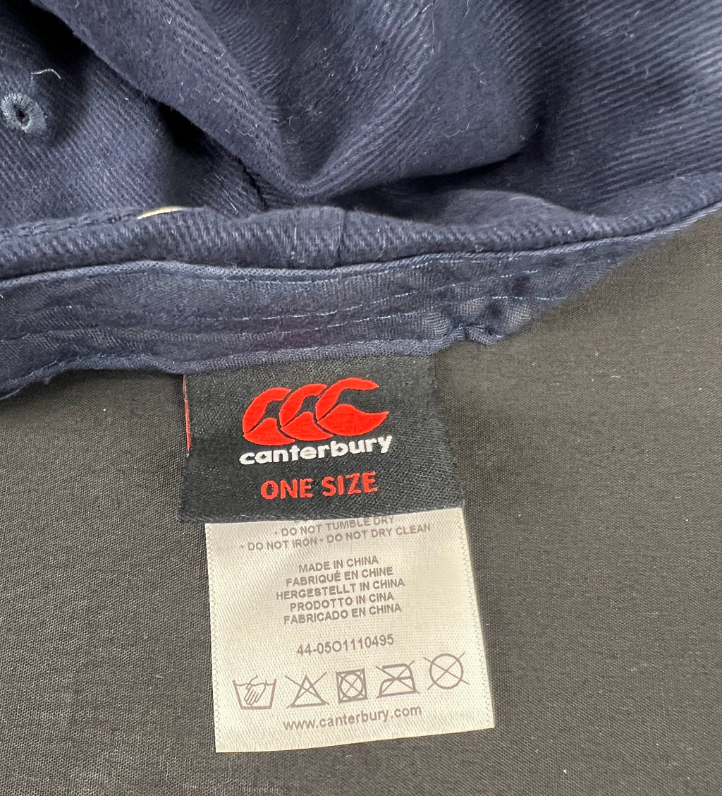 Inside label of Canterbury cap showing care instructions and one size text