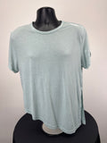 Front view of Gymshark loose fitting light green t-shirt on mannequin