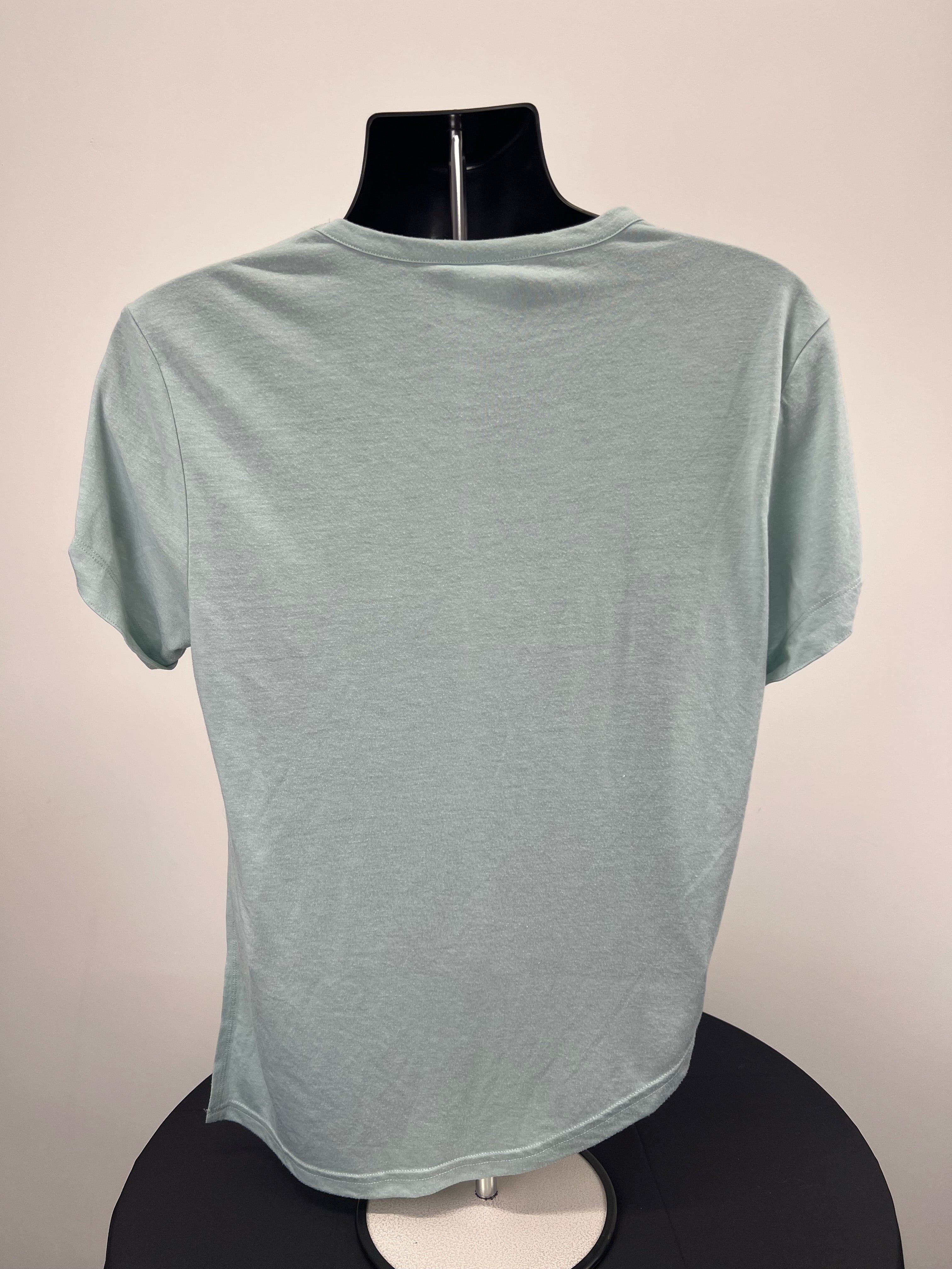 Back view of Gymshark loose fitting light green t-shirt on mannequin