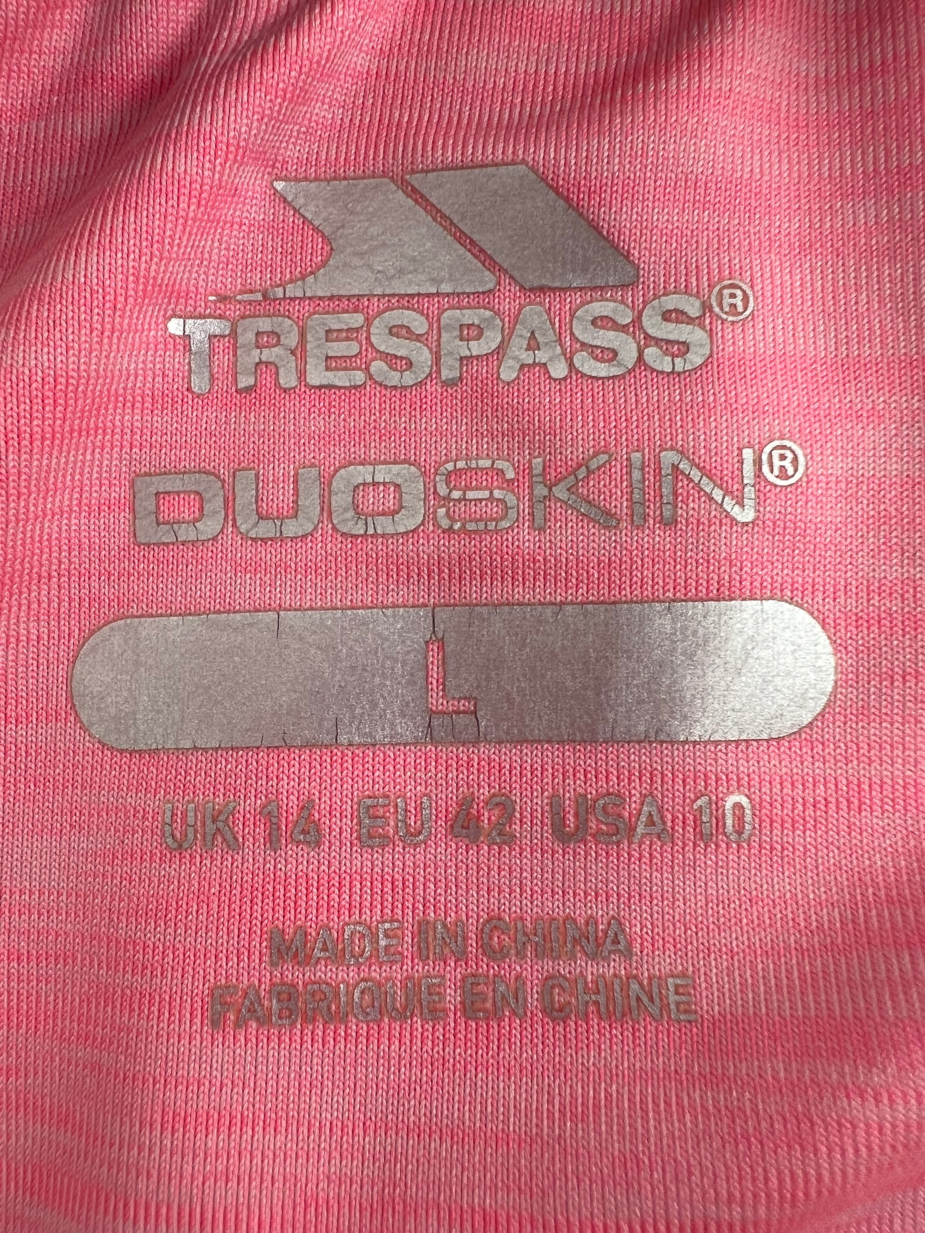 Close-up of Trespass Duoskin logo and size label printed on pink t-shirt