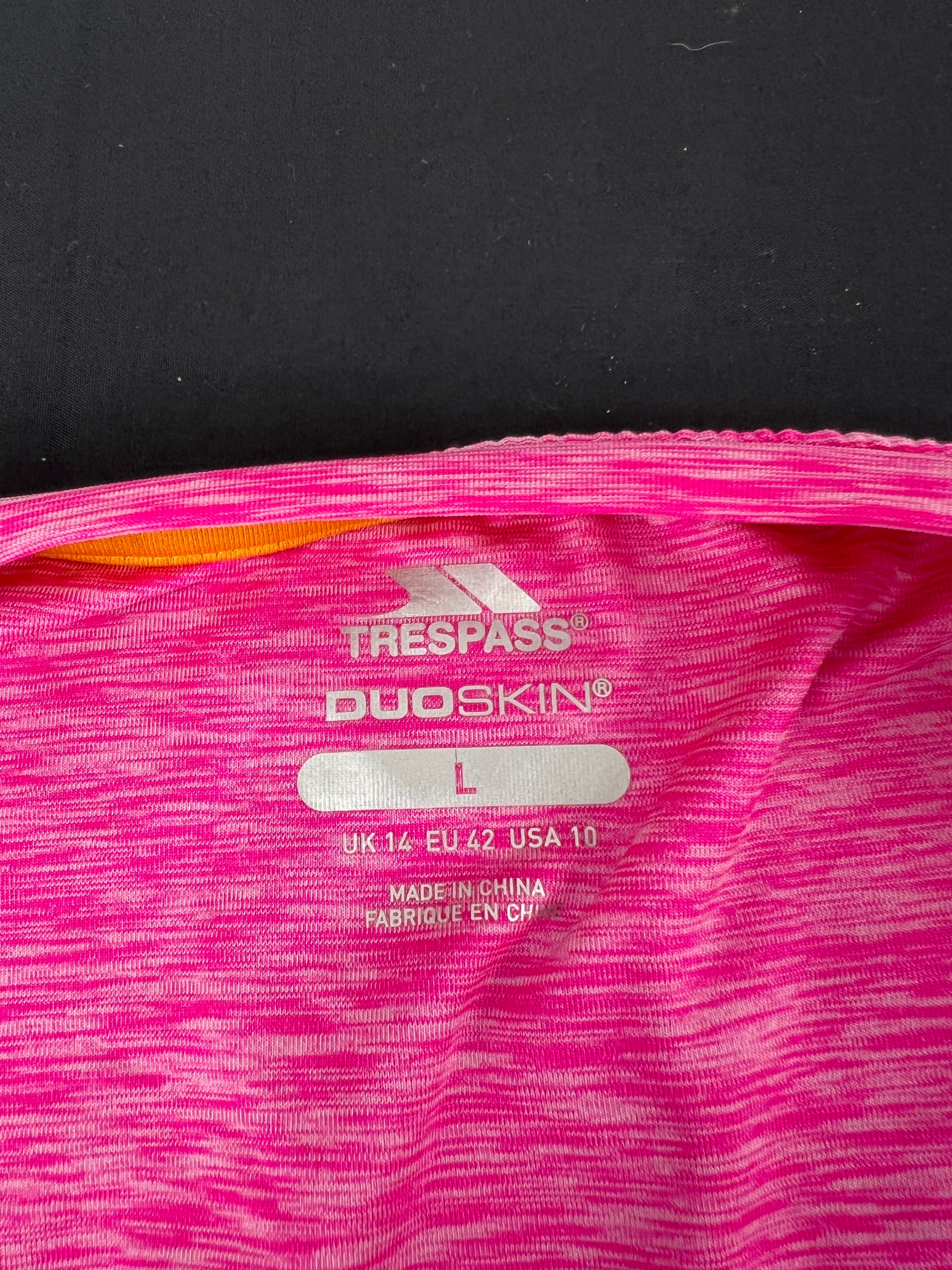 Close-up of size label inside Trespass Duoskin pink T-shirt showing size L and brand logo