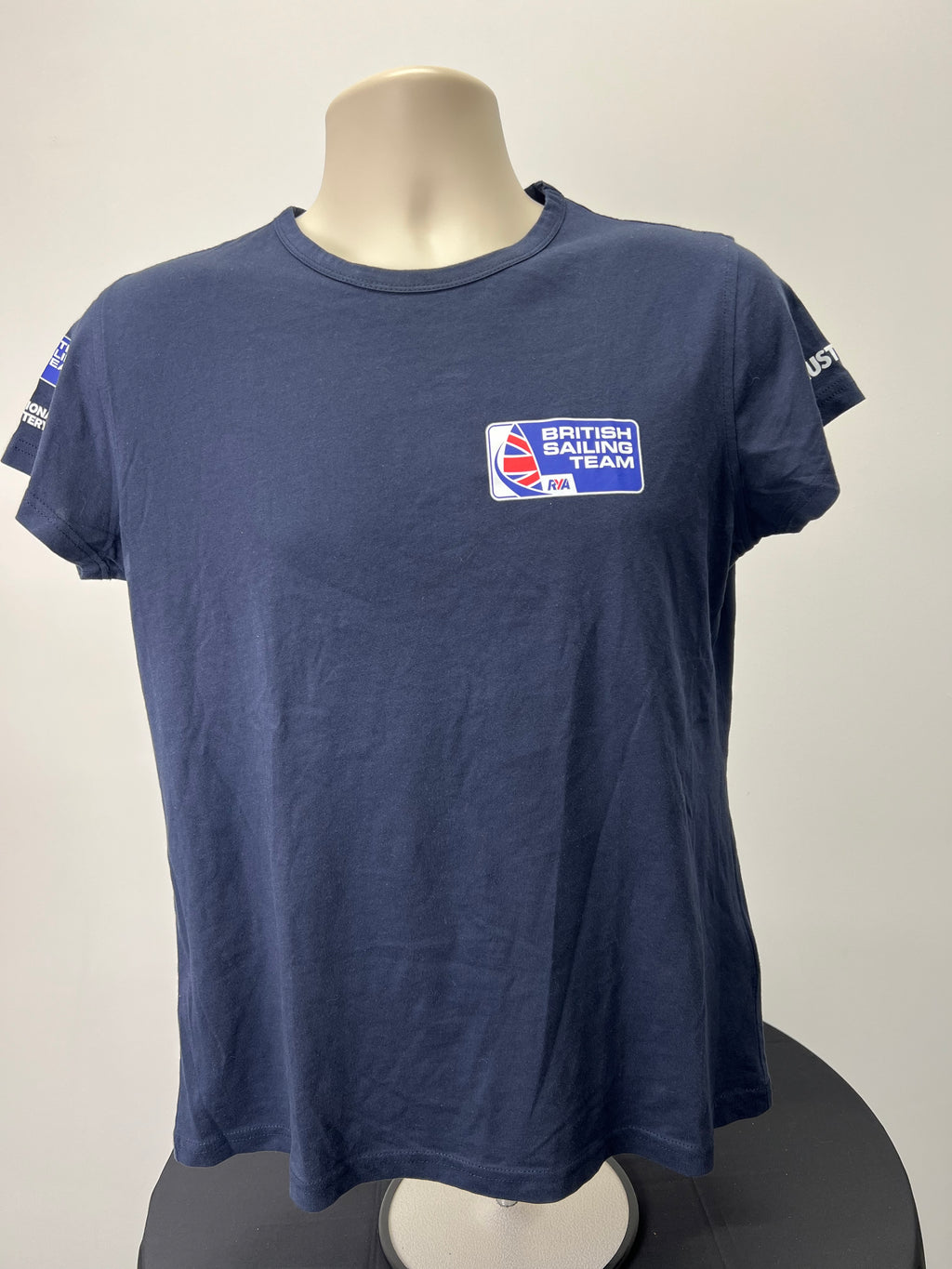 Front view of navy blue British Sailing Team women's t-shirt with logo on chest
