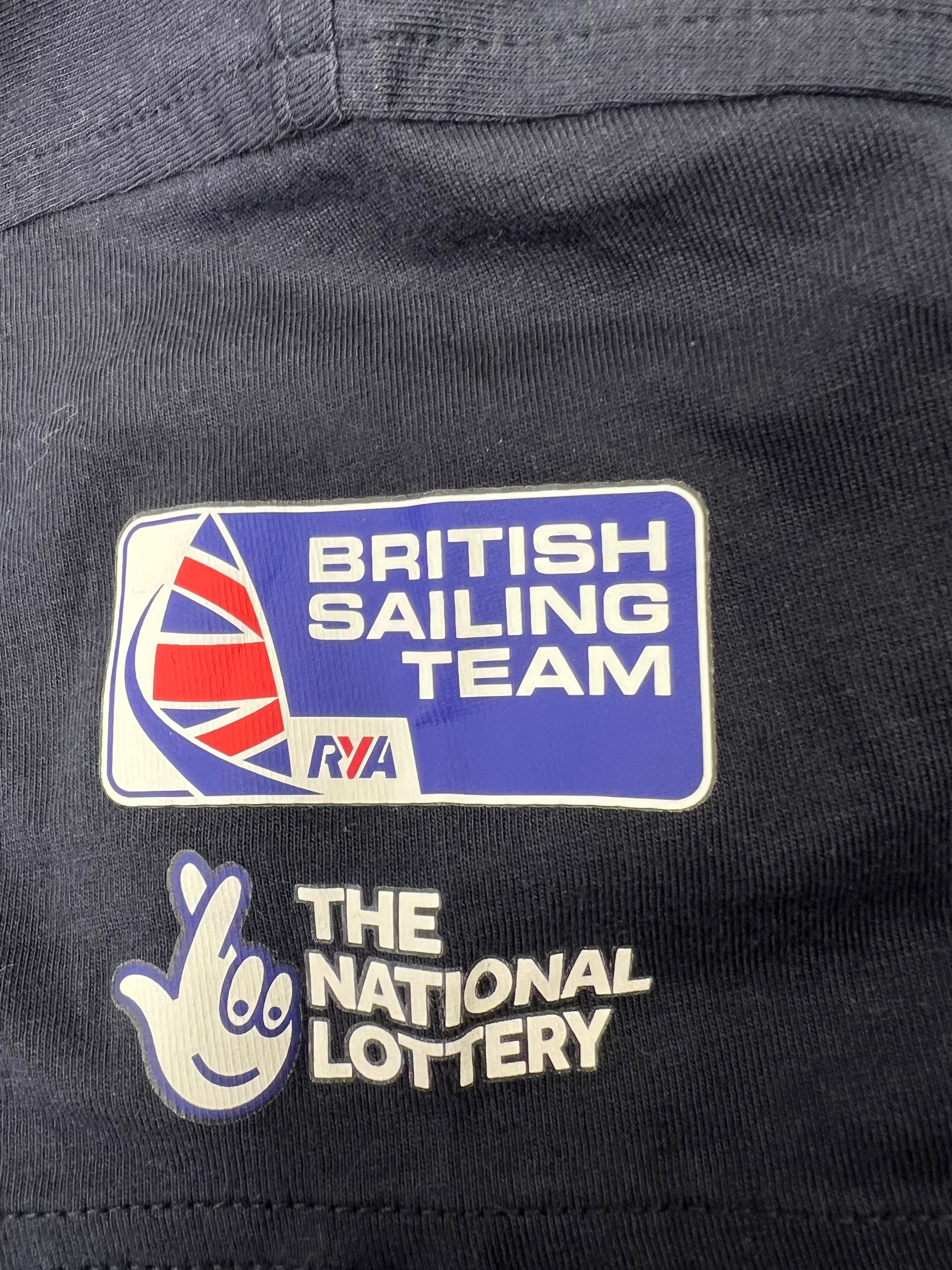Detailed shot of British Sailing Team and National Lottery logos printed on the front of the t-shirt