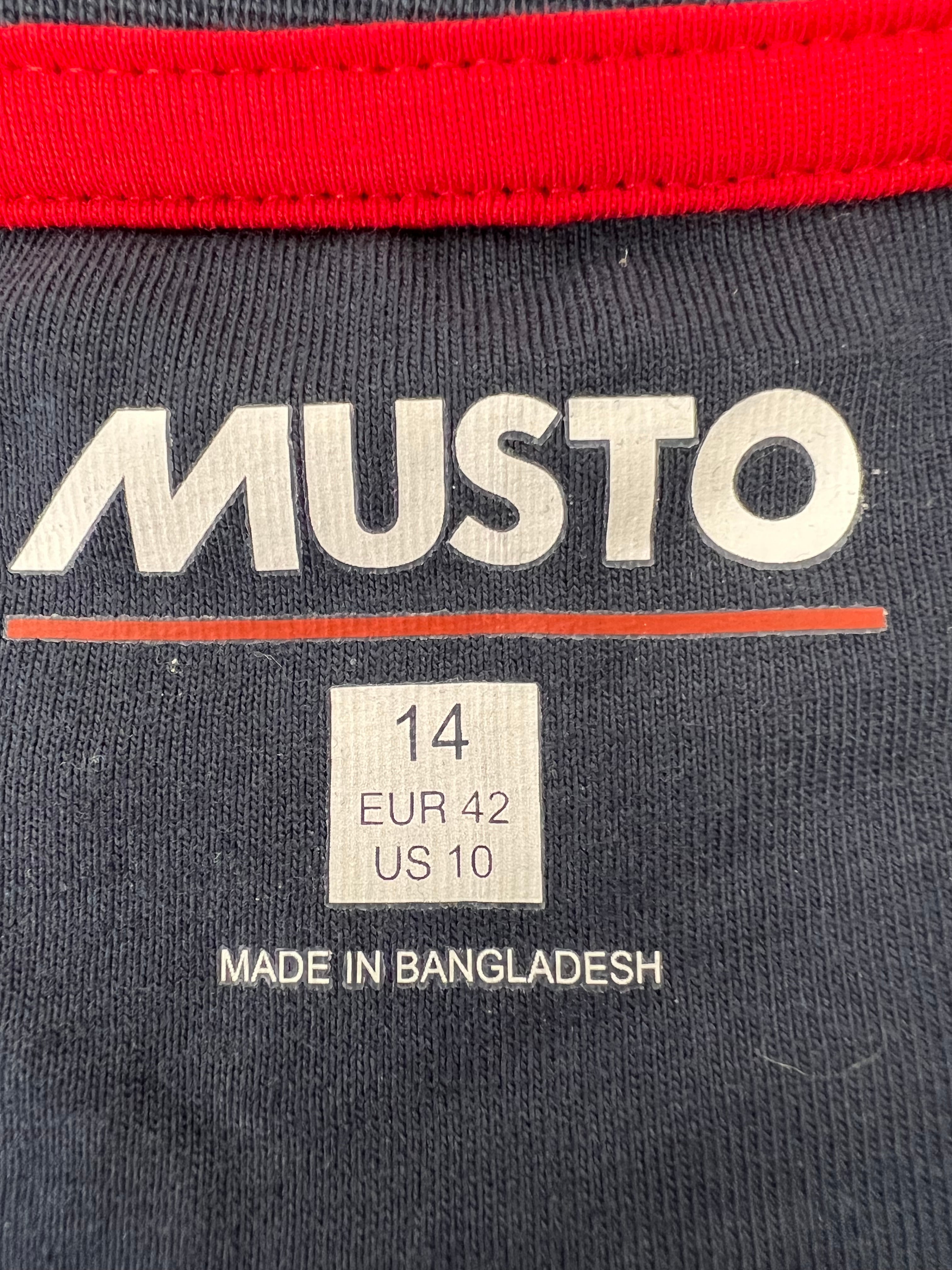 Label inside navy t-shirt showing Musto branding and size information with Made in Bangladesh tag