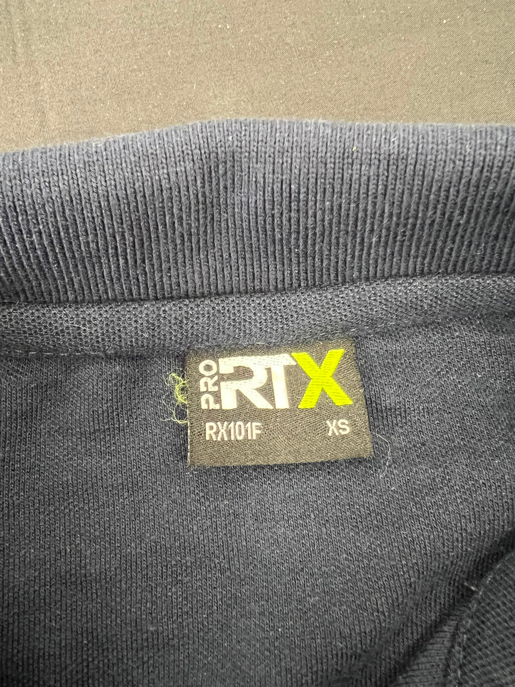 Close-up of inner label tag showing Pro RTX brand and size XS