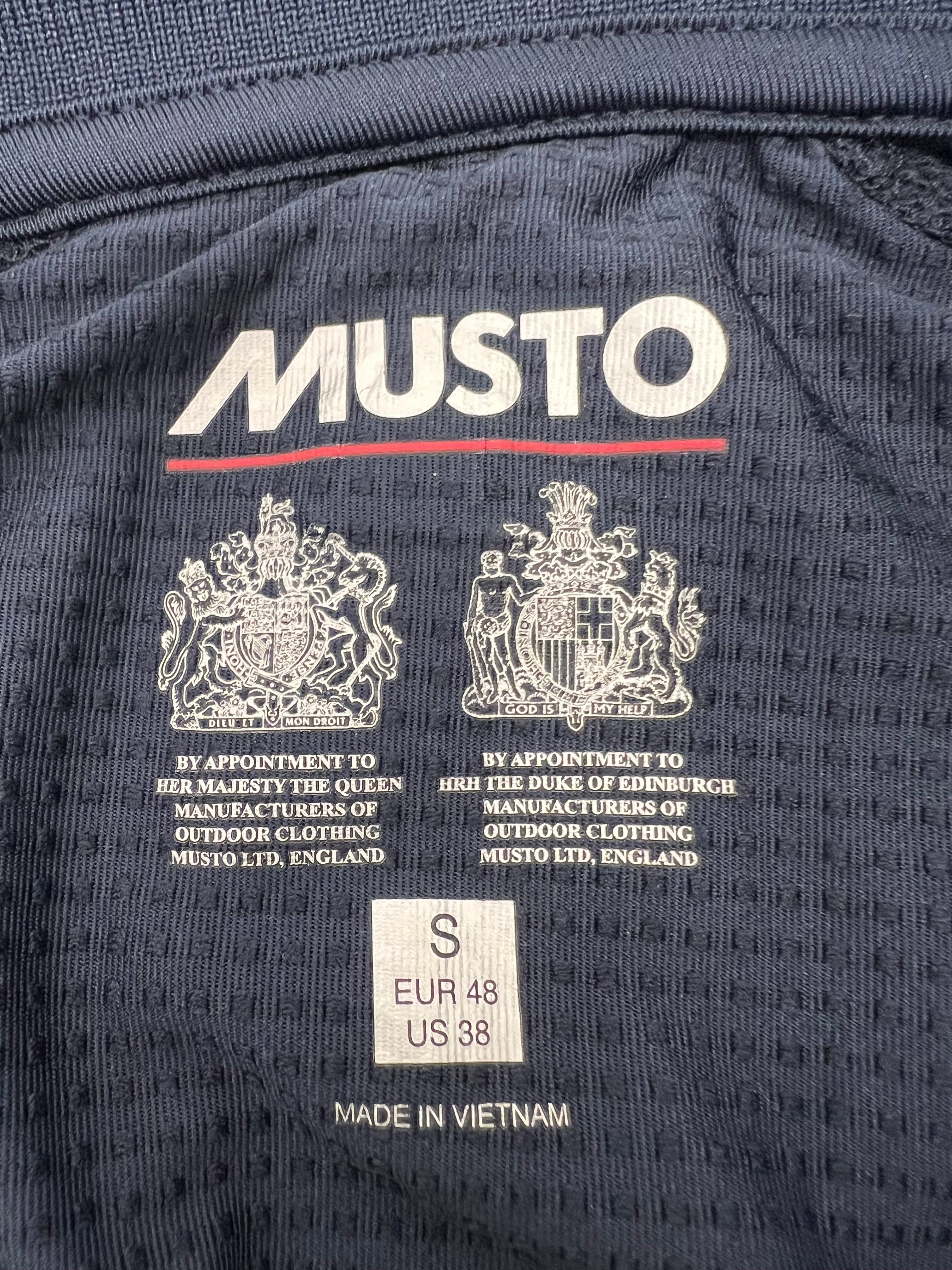Interior label showing Musto branding, size small, and manufacturing details