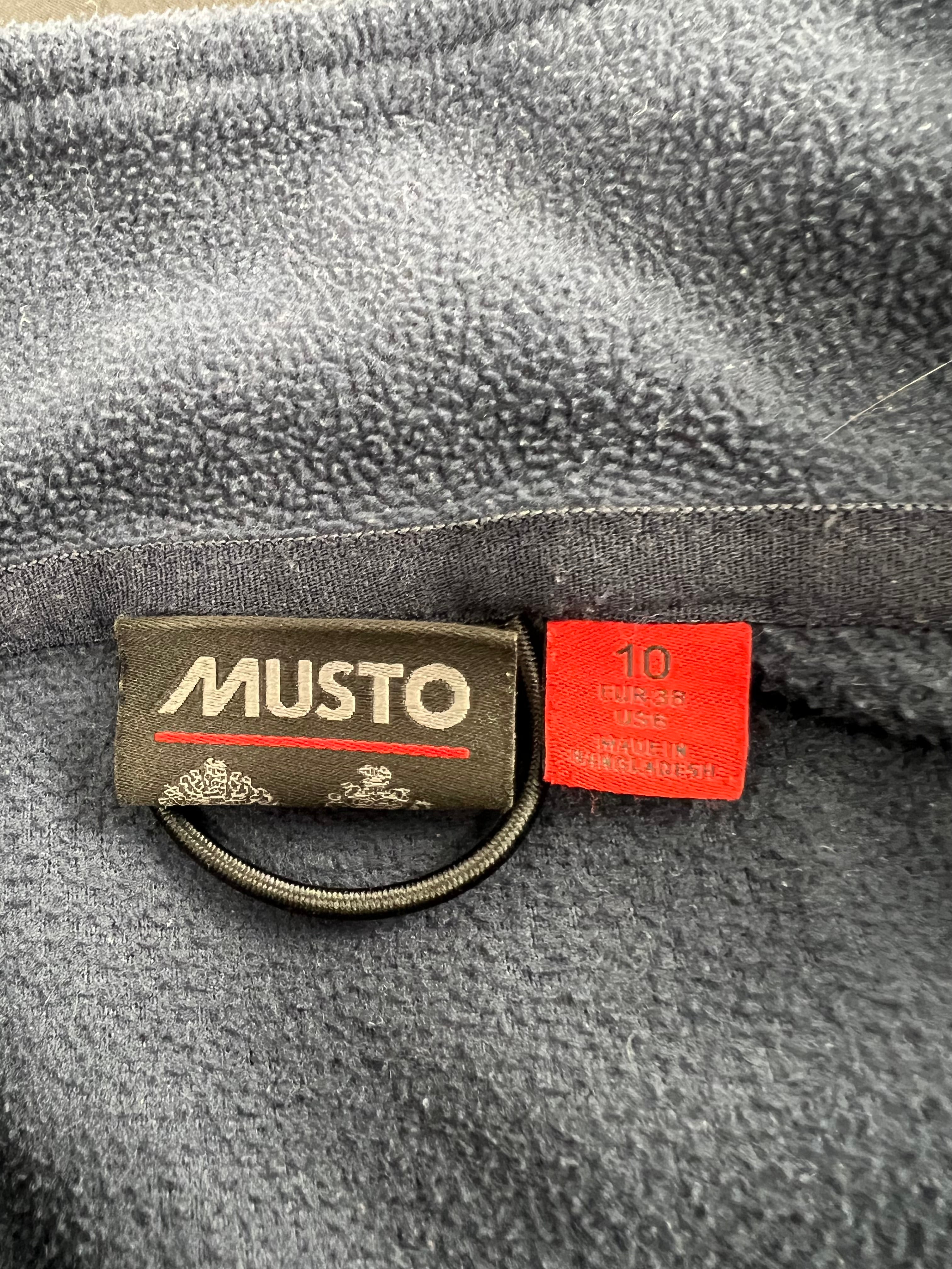 Close-up of Musto brand label and size 10 tag inside navy blue fleece sweatshirt