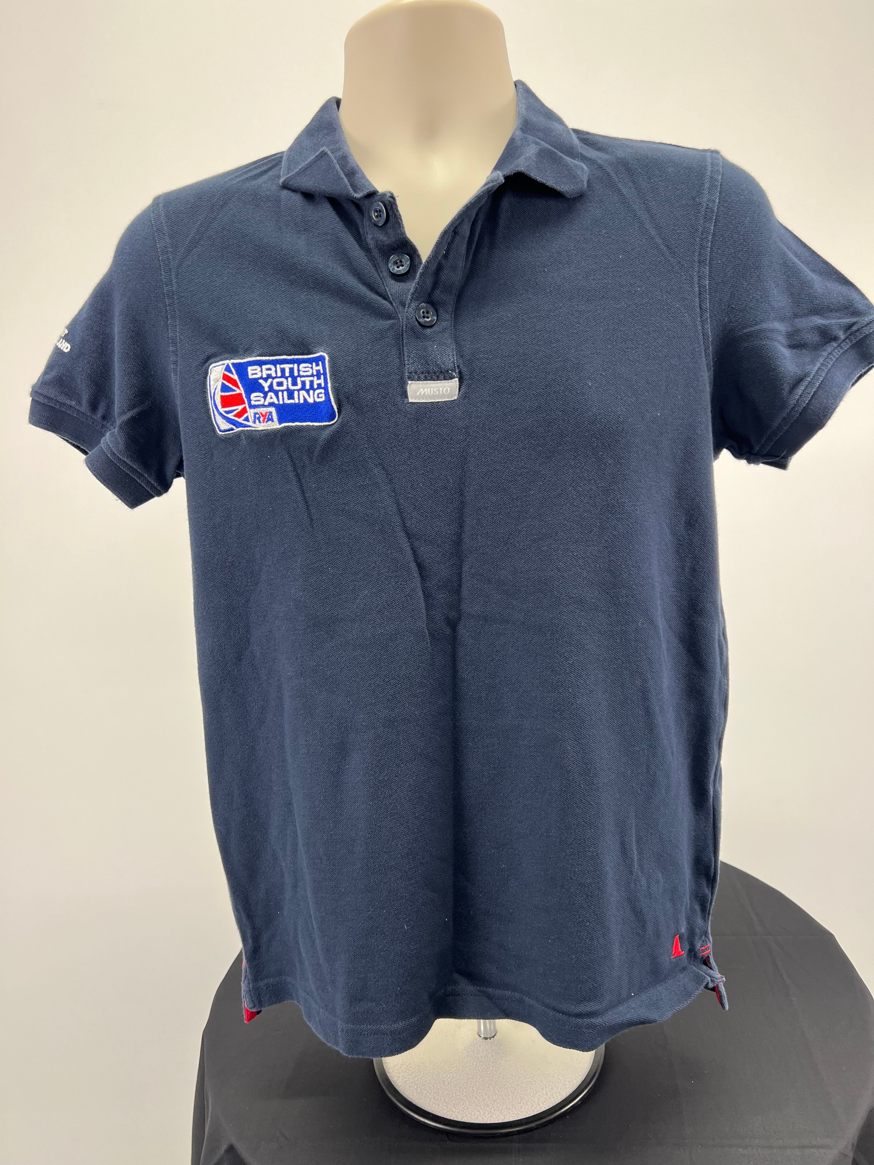 Front view of navy blue Musto British Youth Sailing polo shirt with collar and three buttons