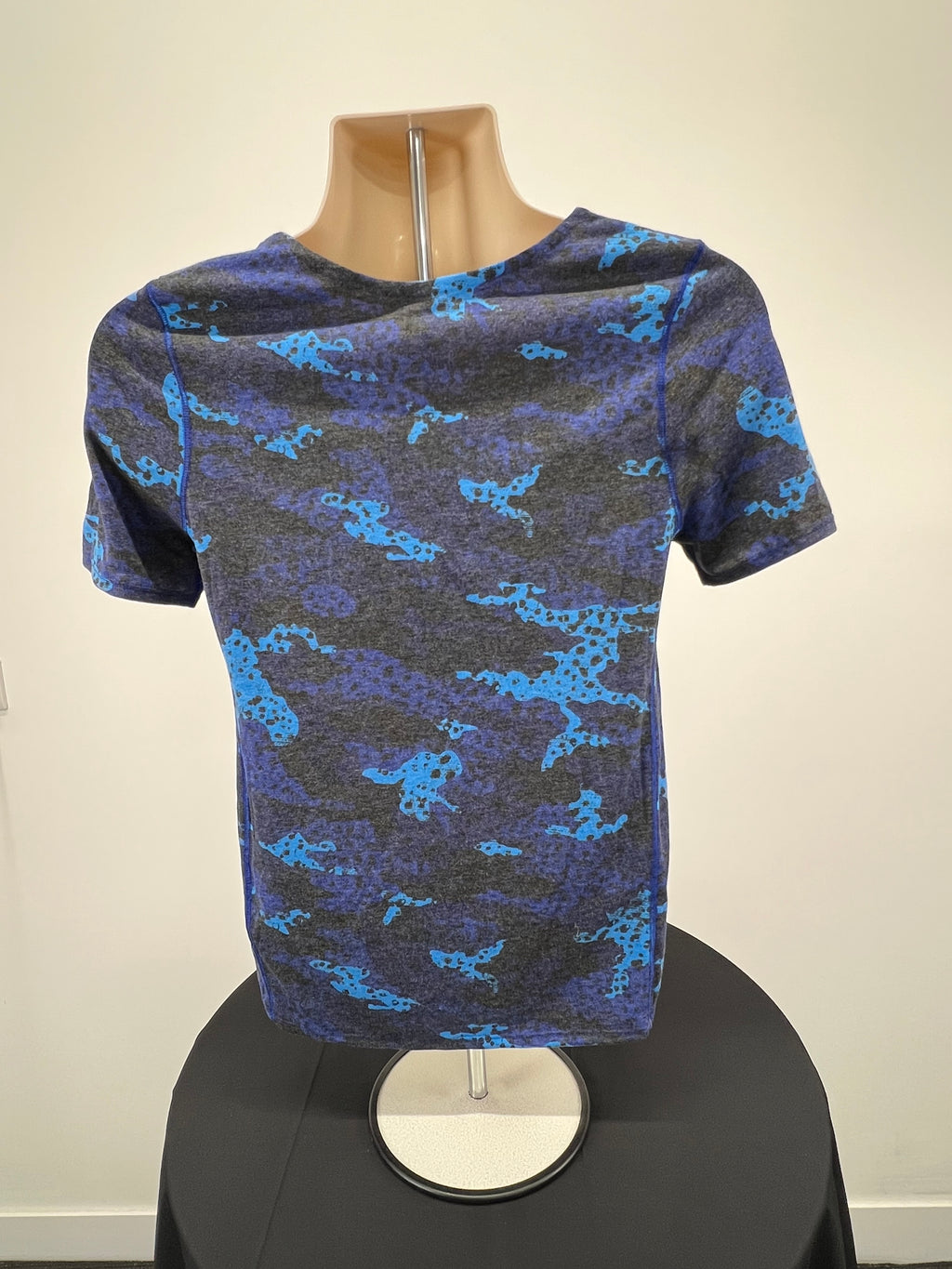 Back view of Nike women's blue camouflage t-shirt showing full pattern