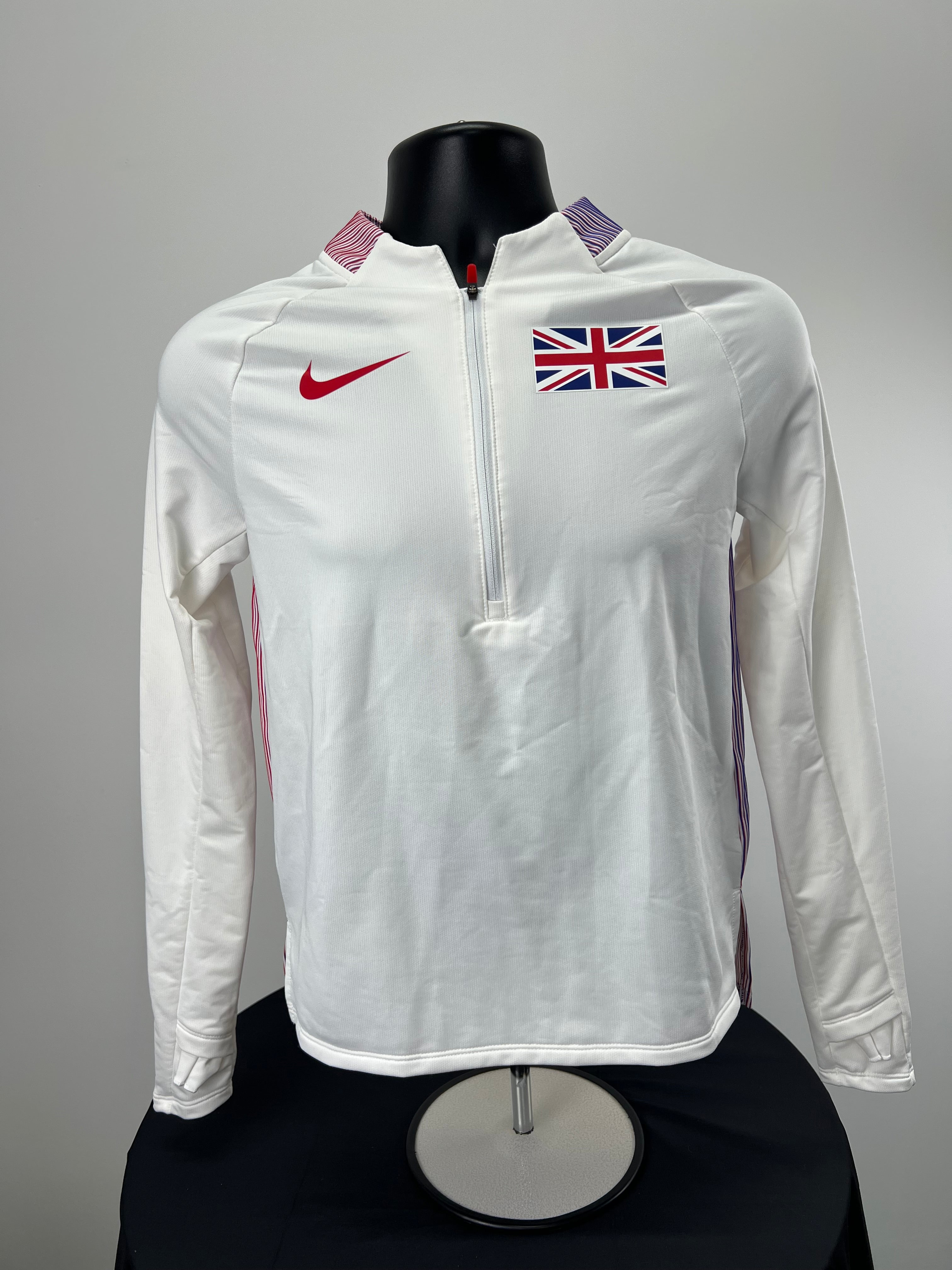 Front view of Nike Great Britain women's half zip top in white with Union Jack and red Nike logo