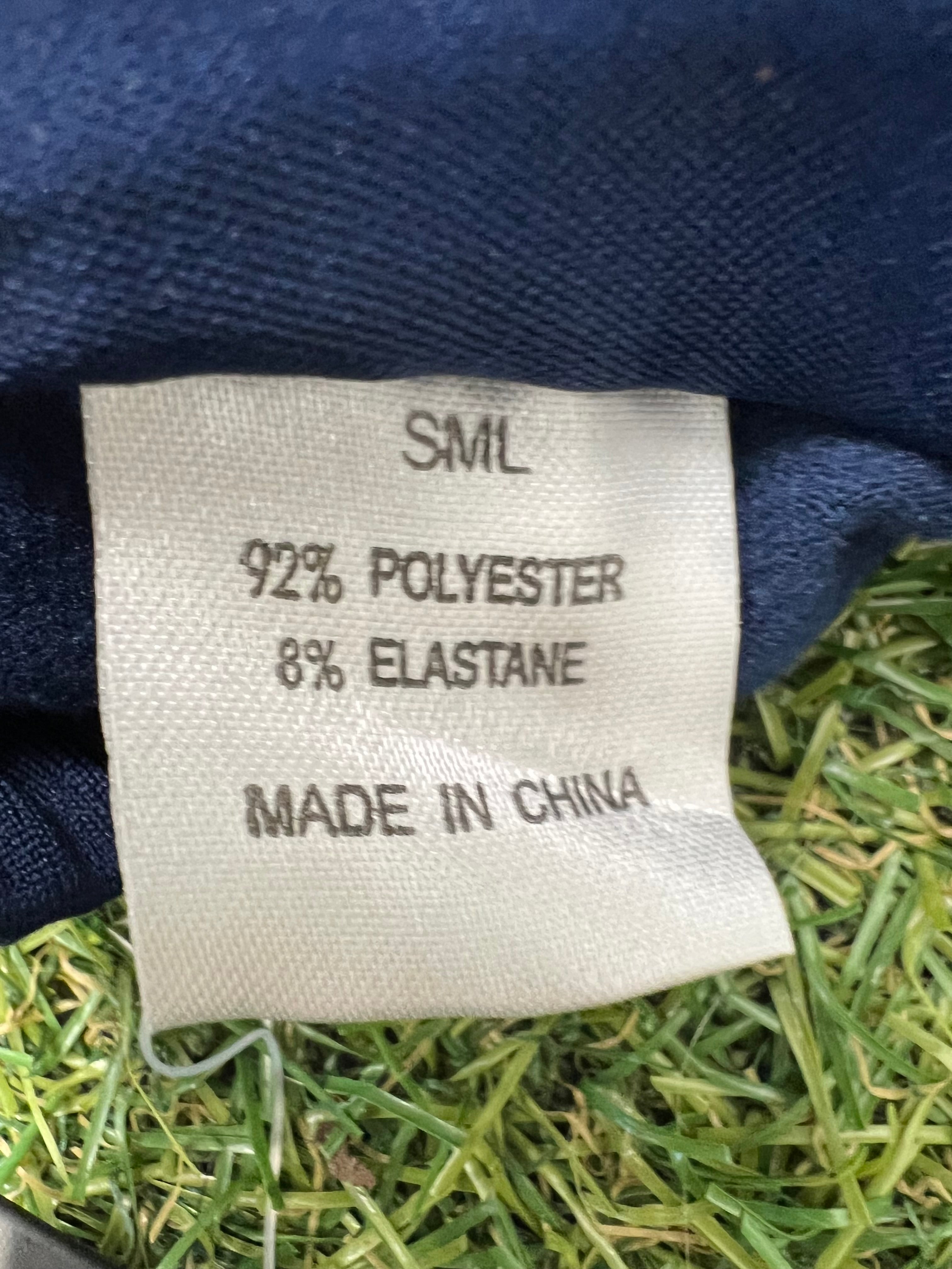 Close-up image of product label detailing fabric composition: 92% polyester, 8% elastane, made in China