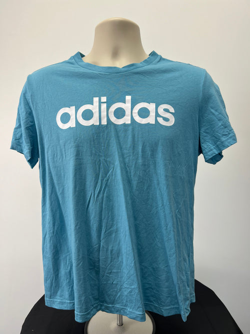 Front view of a turquoise adidas t-shirt with white logo on a mannequin