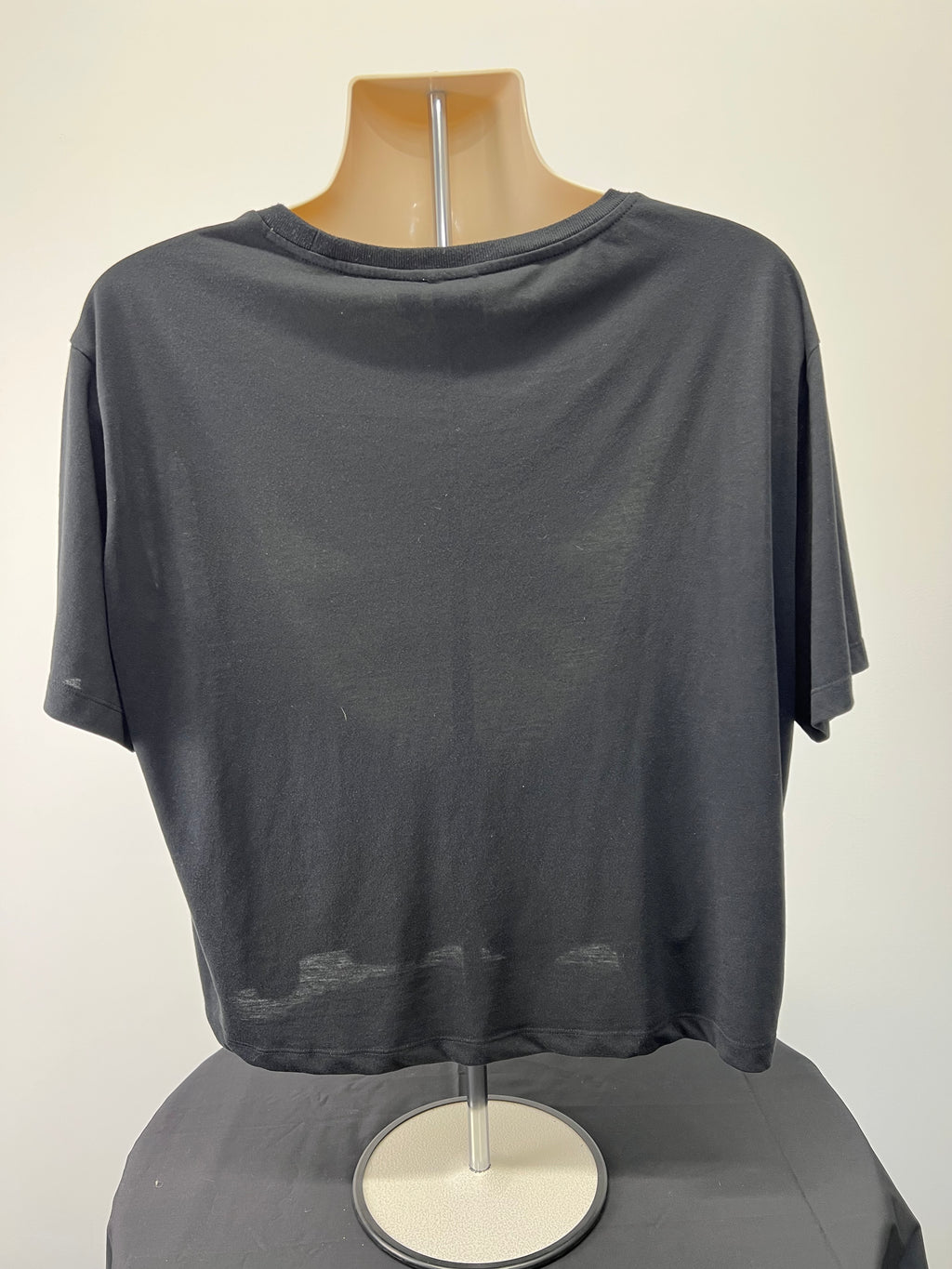 Back view of Adidas black women's t-shirt showing plain design with short sleeves