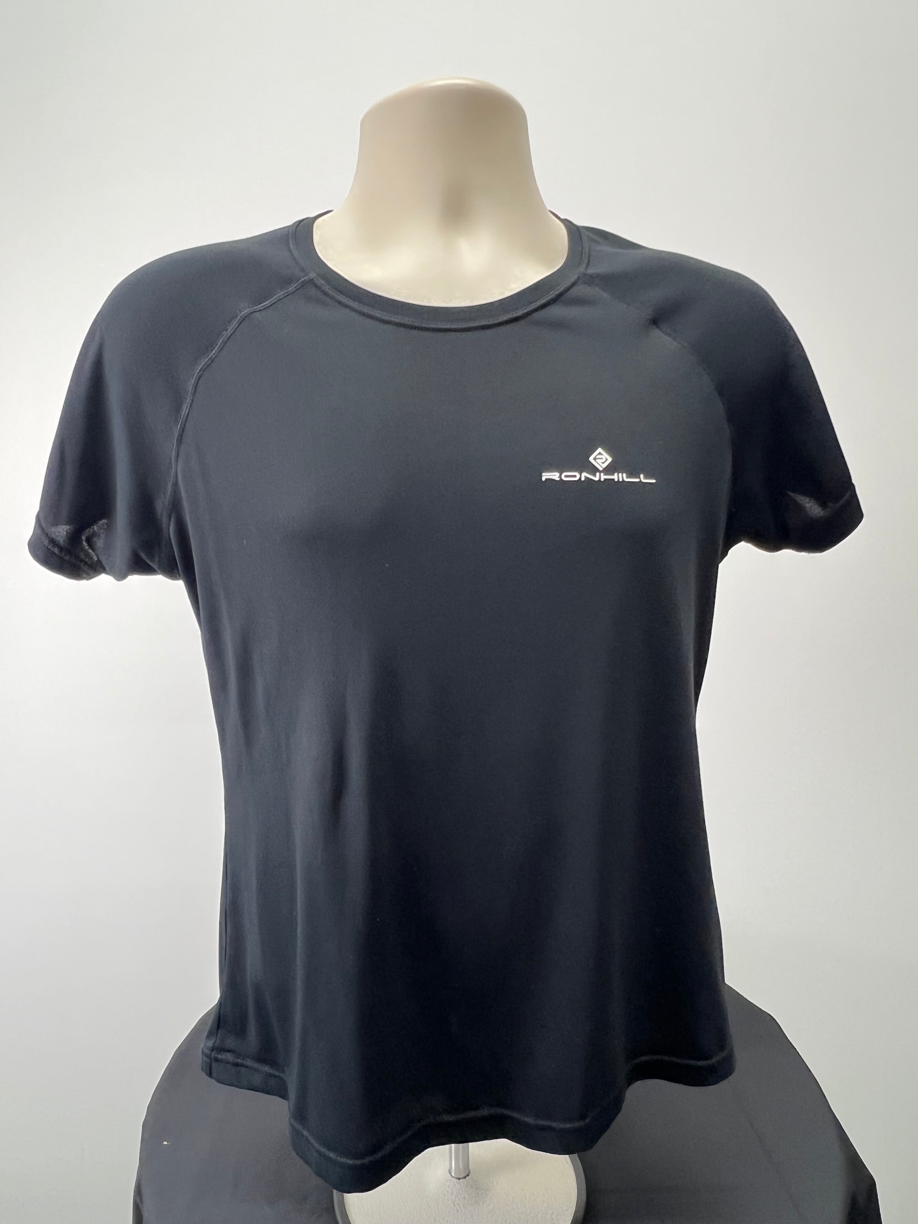 Front view of black Ronhill women's performance t-shirt on mannequin with logo on chest