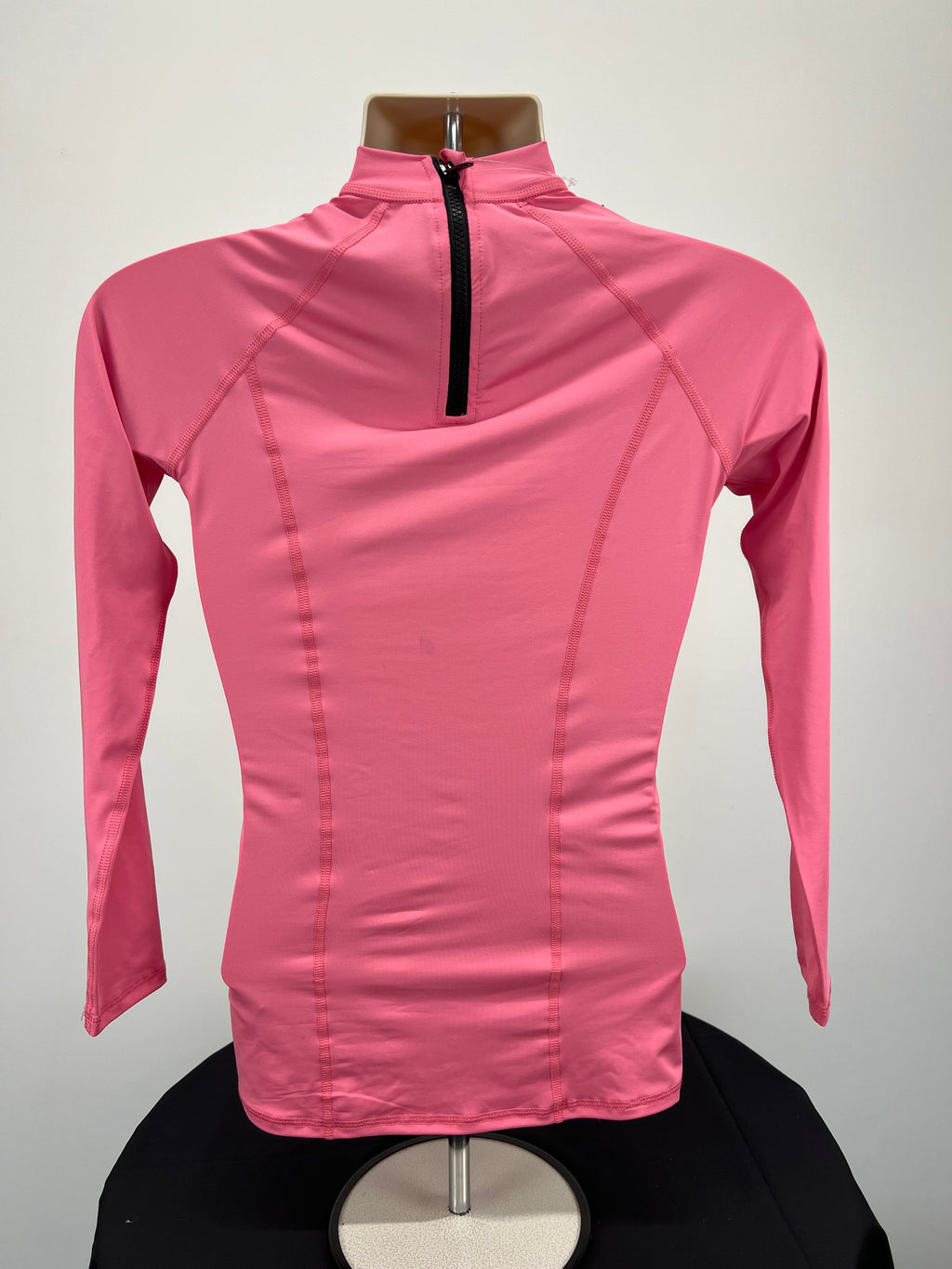 Back view of pink Ladies UV Rash Vest by Mistral showing half-zip closure