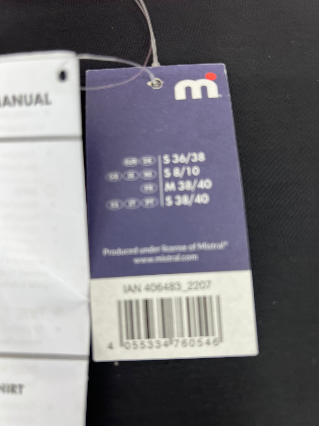 Close-up of product size tag showing multiple European size options and barcode