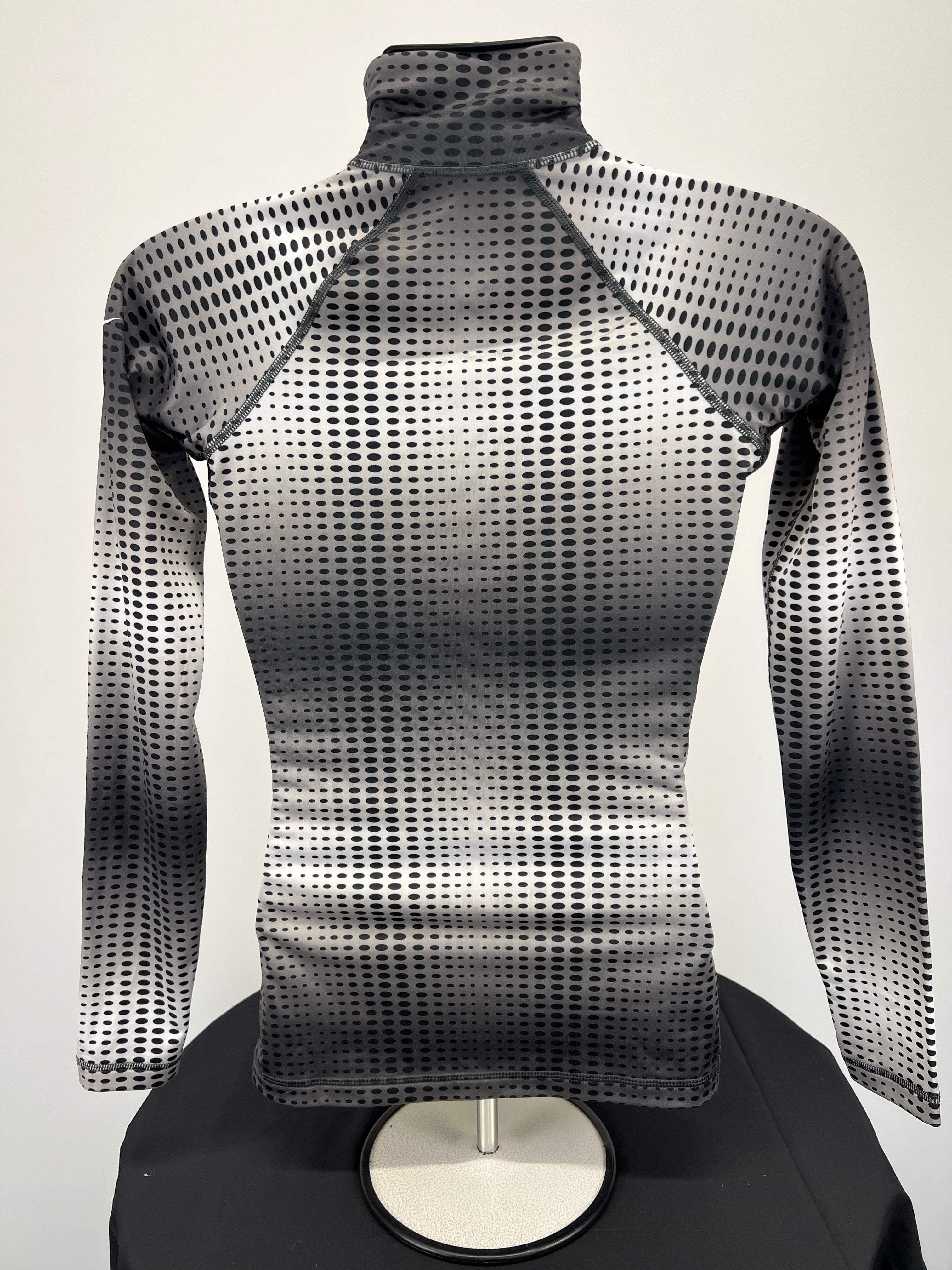 Back view of Nike Pro long sleeve top showing dotted gradient design and raglan sleeves