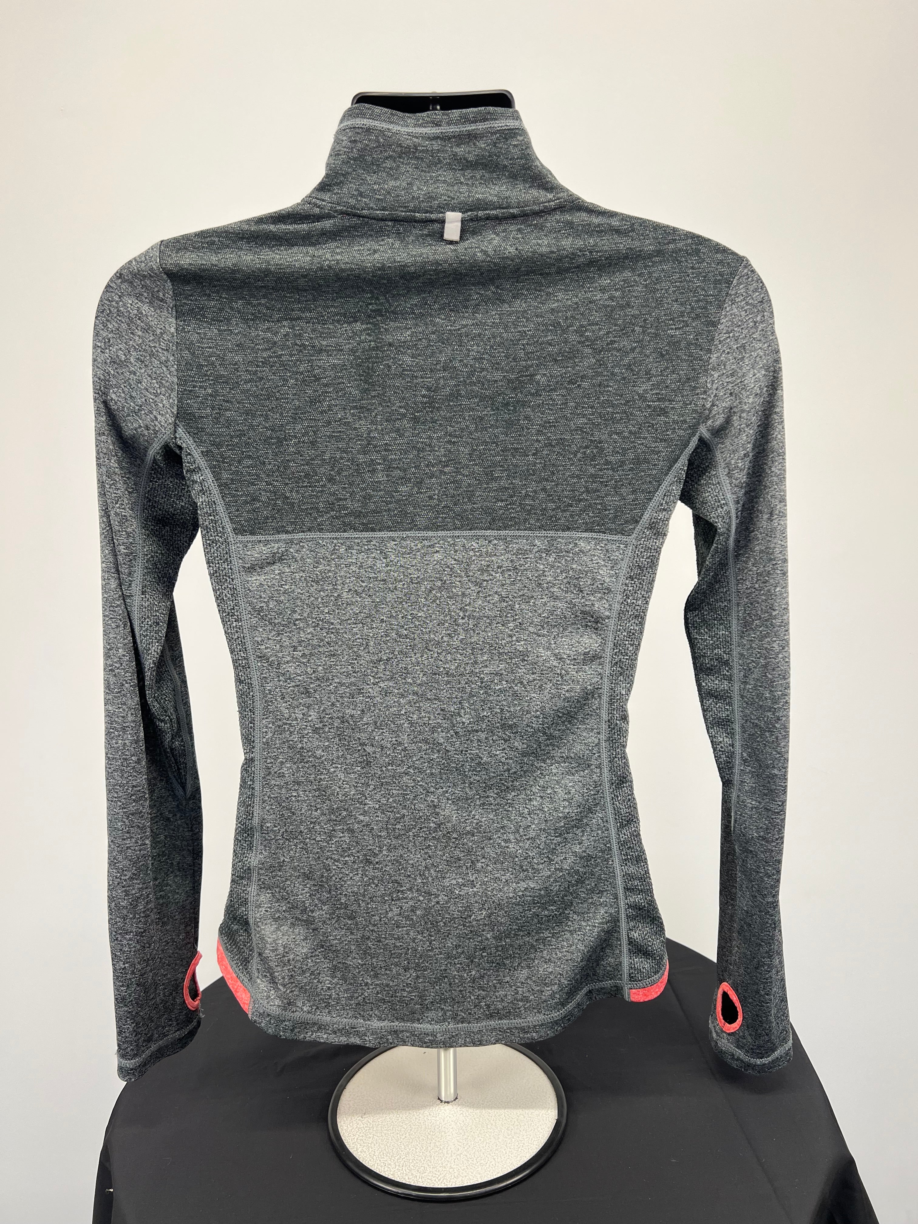 Back view of grey heathered Ellesse women’s full zip jacket showing long sleeves and thumb holes
