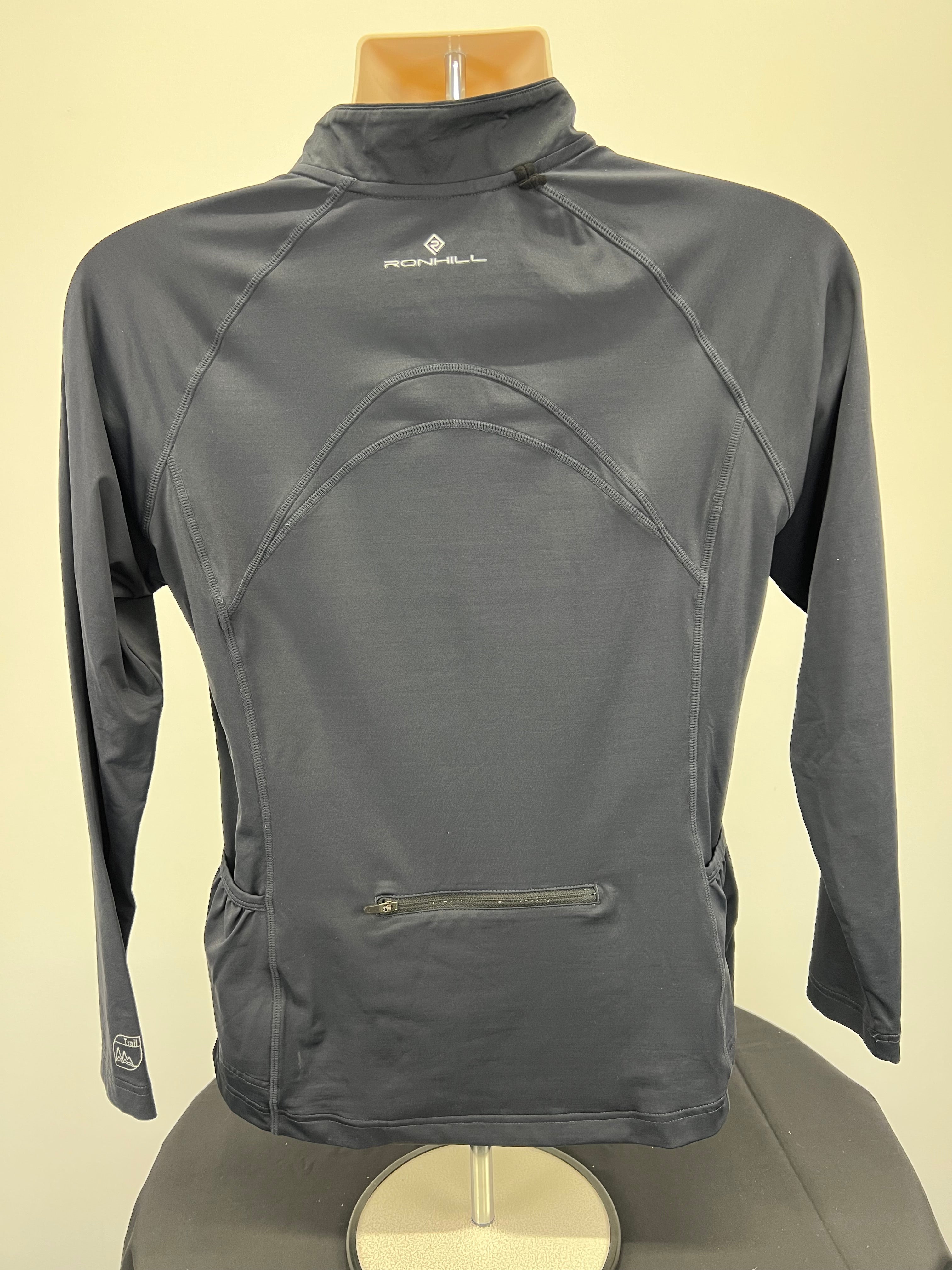 Rear view of black Ronhill long sleeve half-zip running top showing zipped back pocket