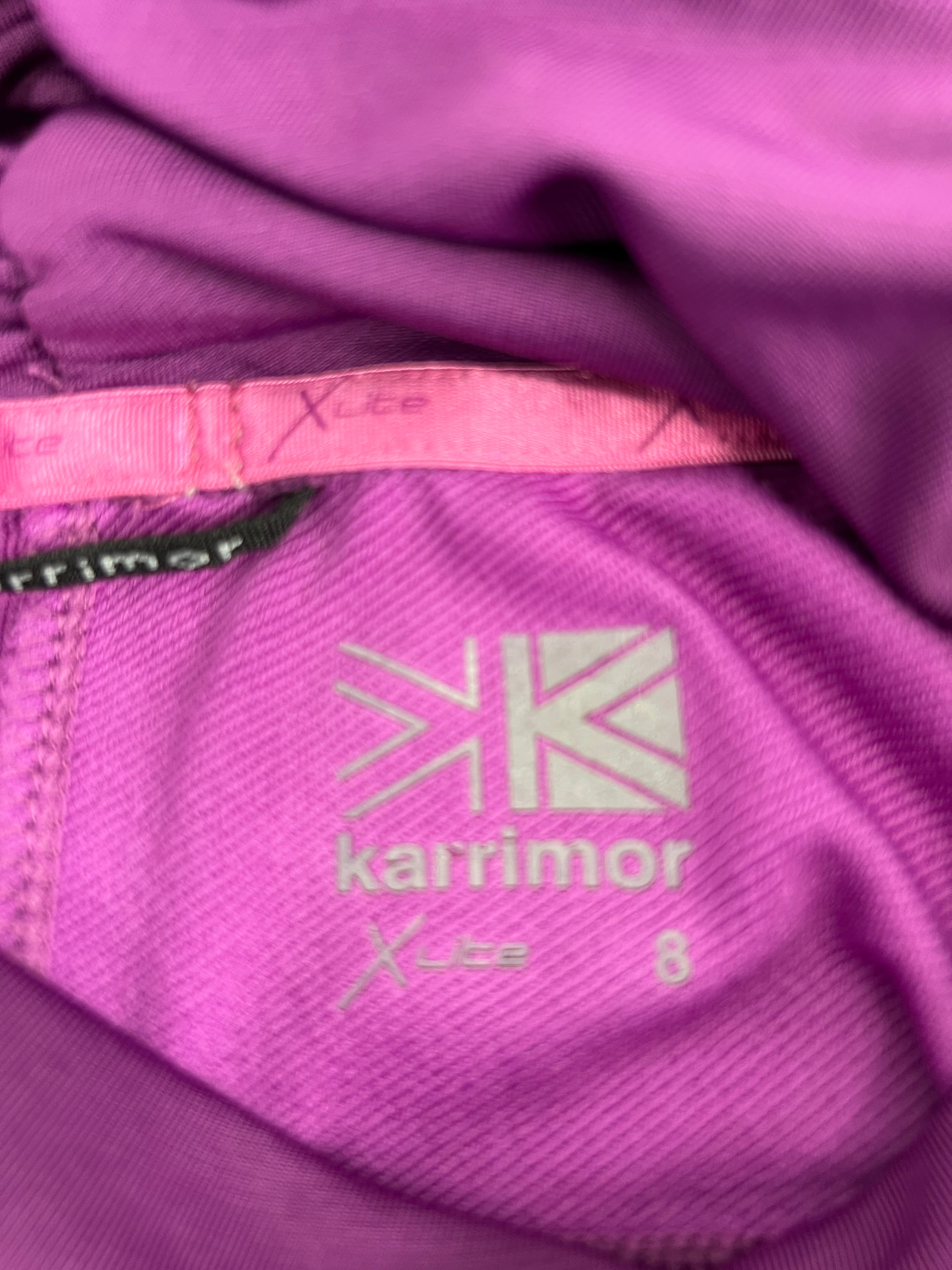 Label inside purple Karrimor Run running top showing size 8 and fabric details