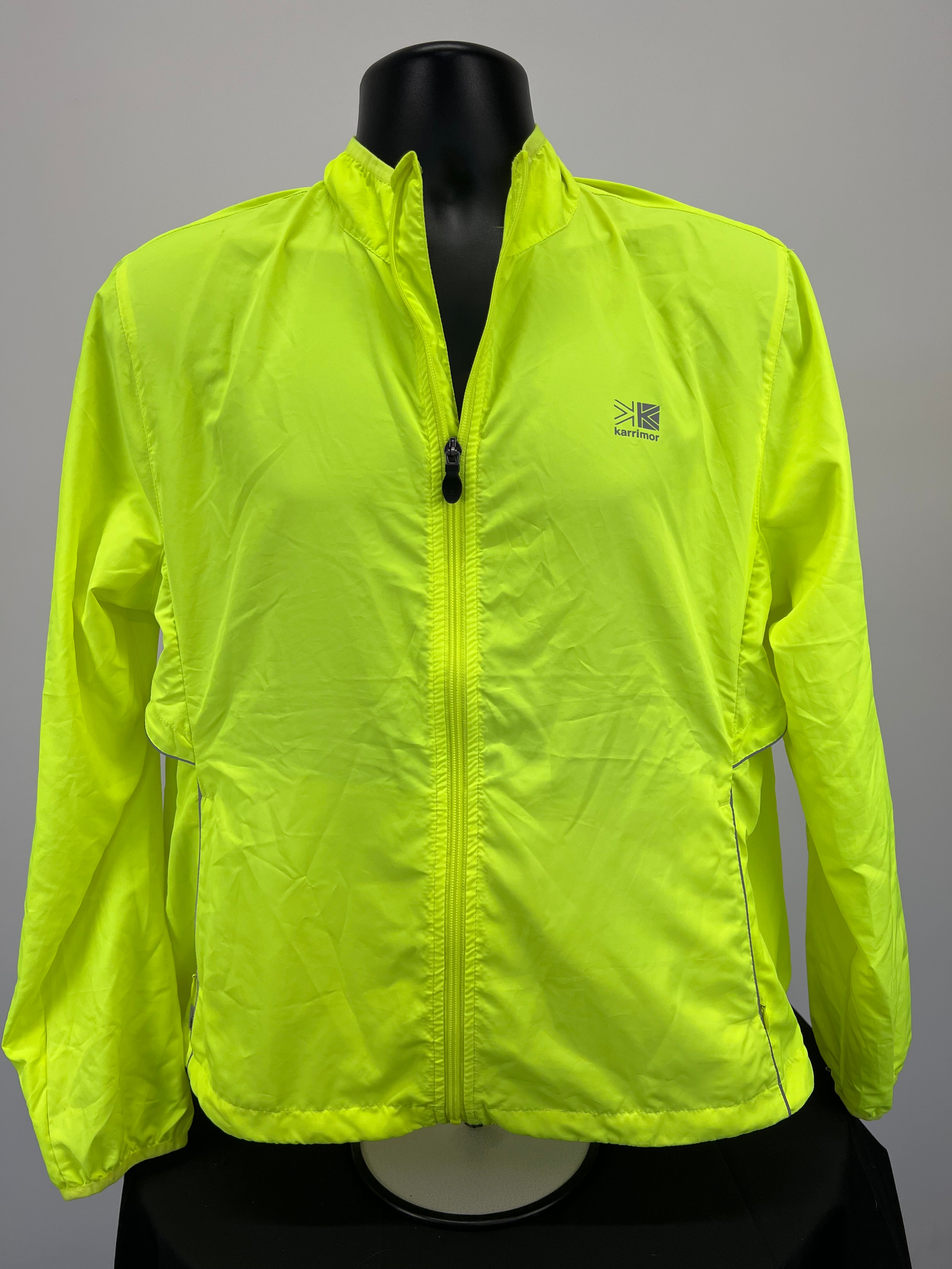 Front view of neon yellow Karrimor lightweight running jacket with zip and elasticated cuffs