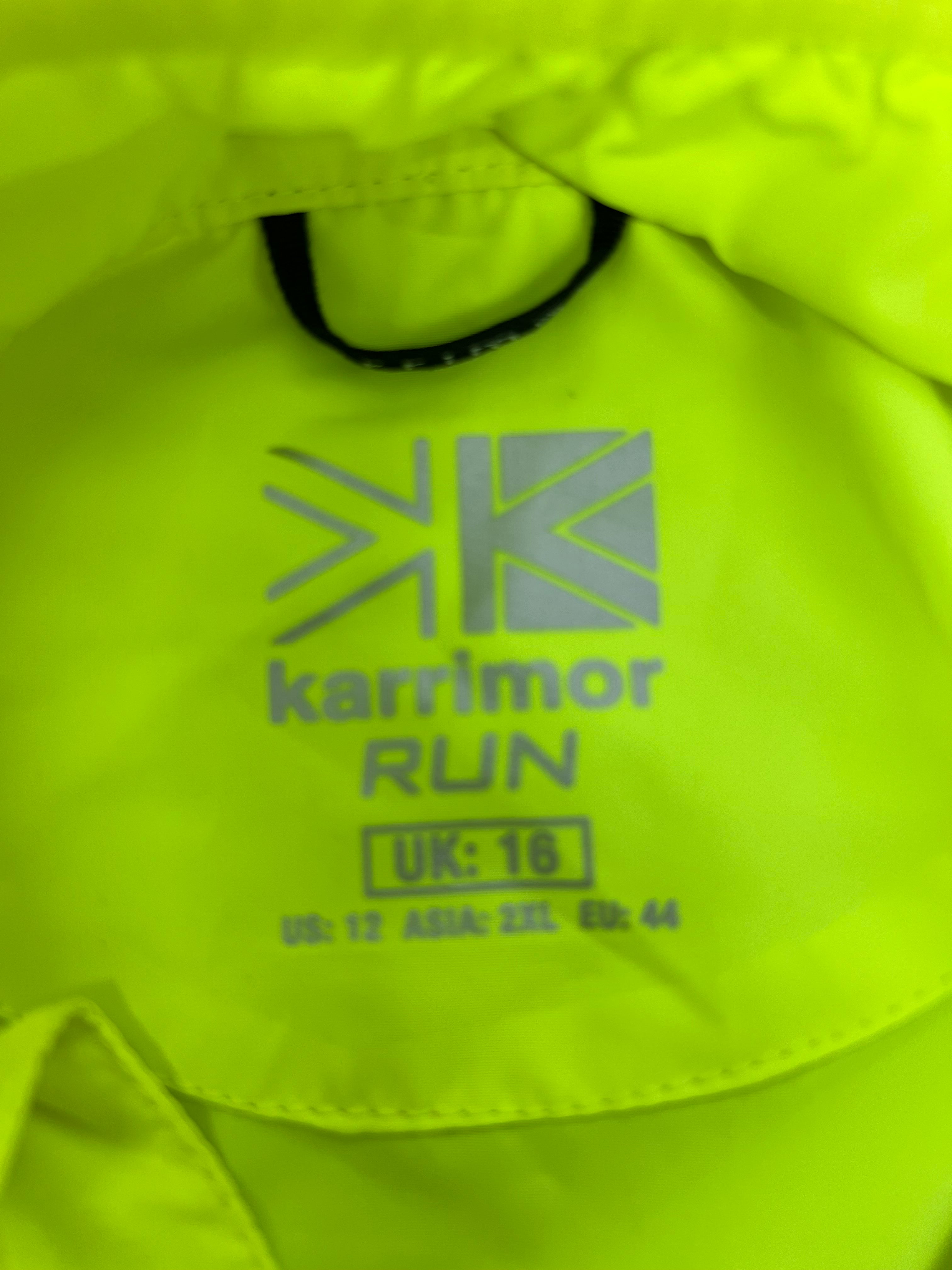 Close-up of inner neck label of Karrimor RUN jacket showing UK size 16 and other size info