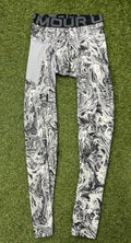 Front view of Under Armour mens compression tights featuring black and white marbled pattern and black elastic waistband with logo on grass background
