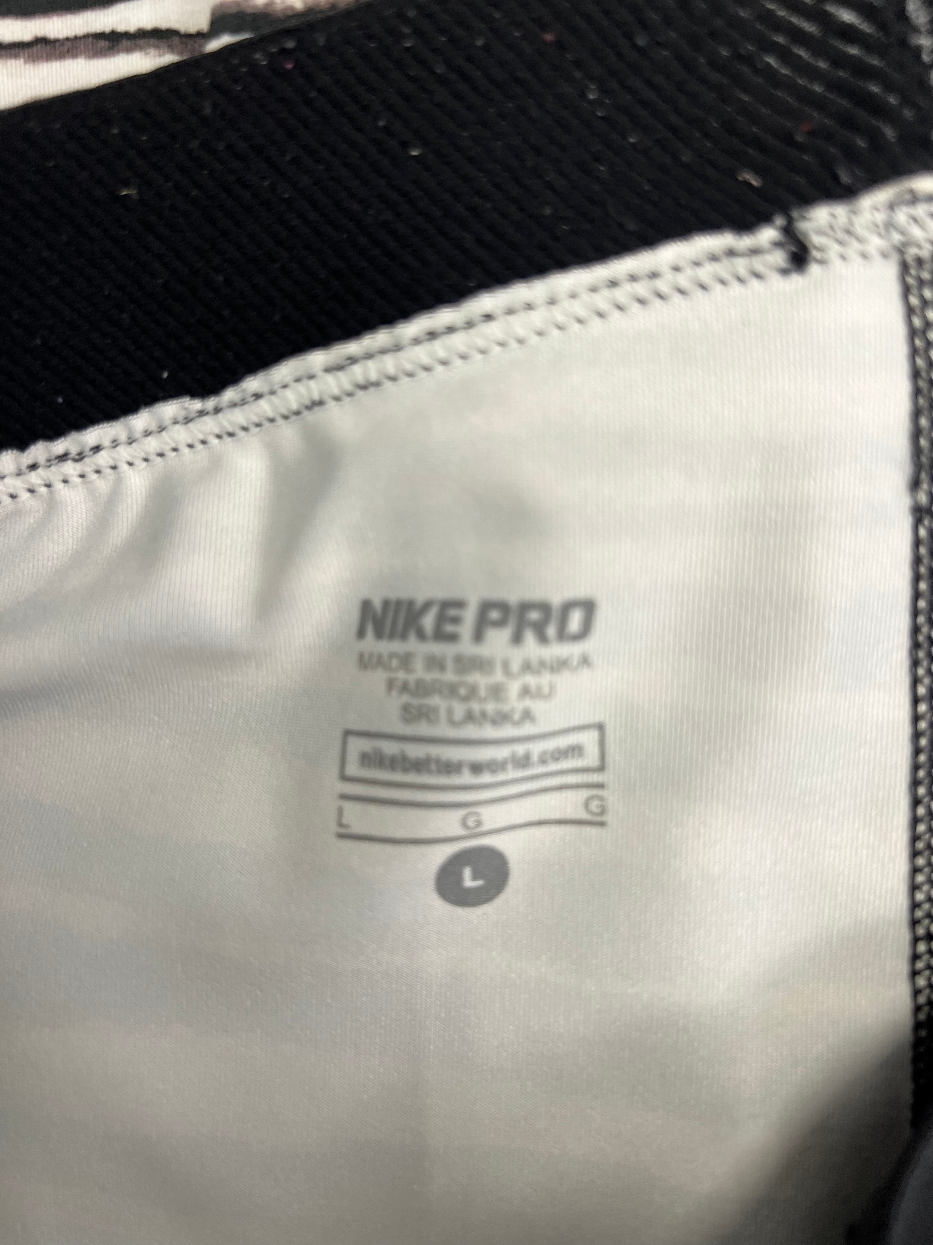 Close-up inside label of Nike Pro leggings showing size Large and made in Sri Lanka