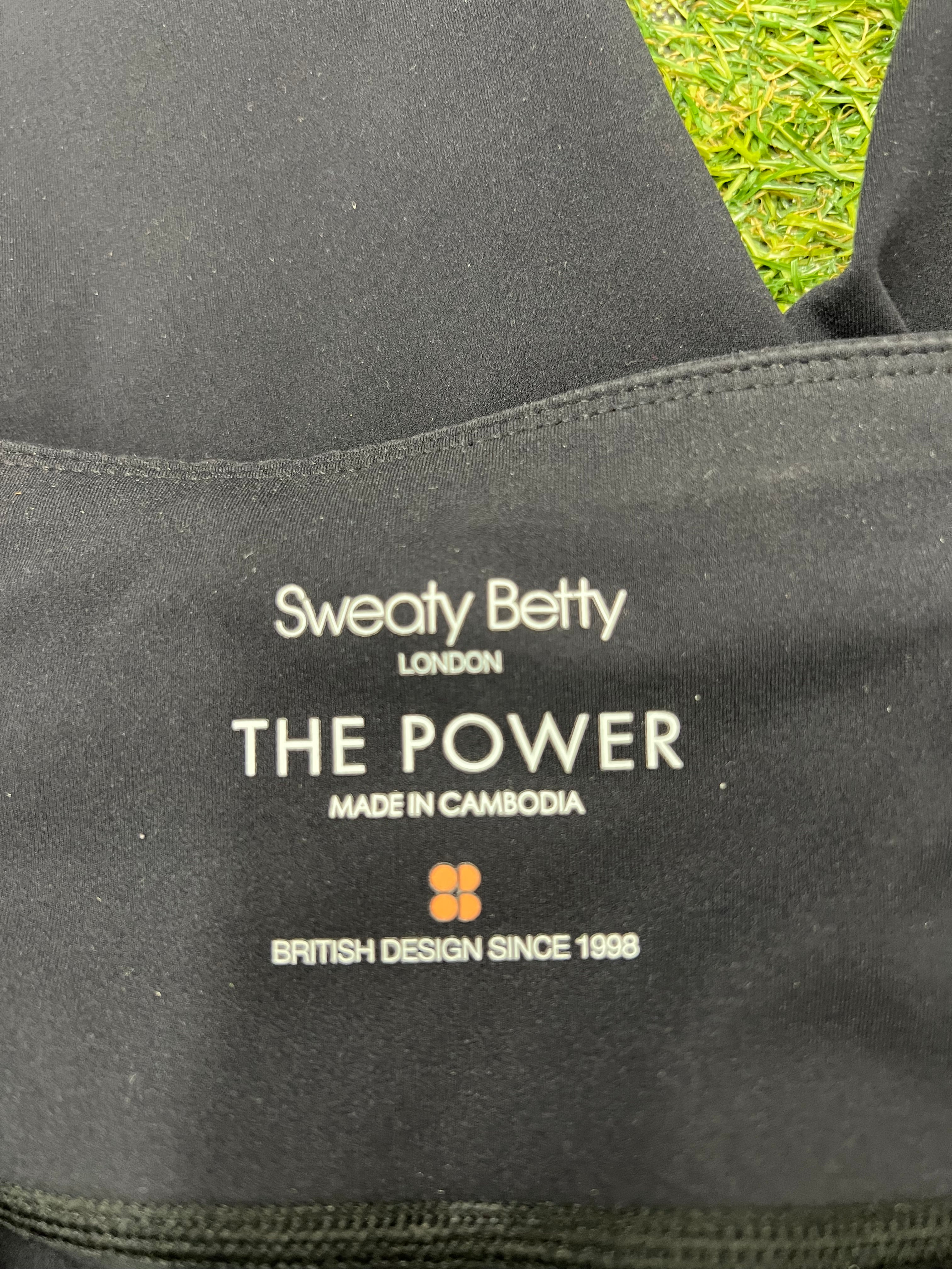 Close-up image of internal branding label inside waistband that reads Sweaty Betty London The Power made in Cambodia