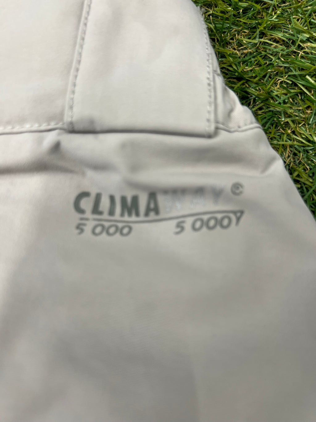 Inside label of Lafuma essentials showing size XXL and brand logo on grey lining
